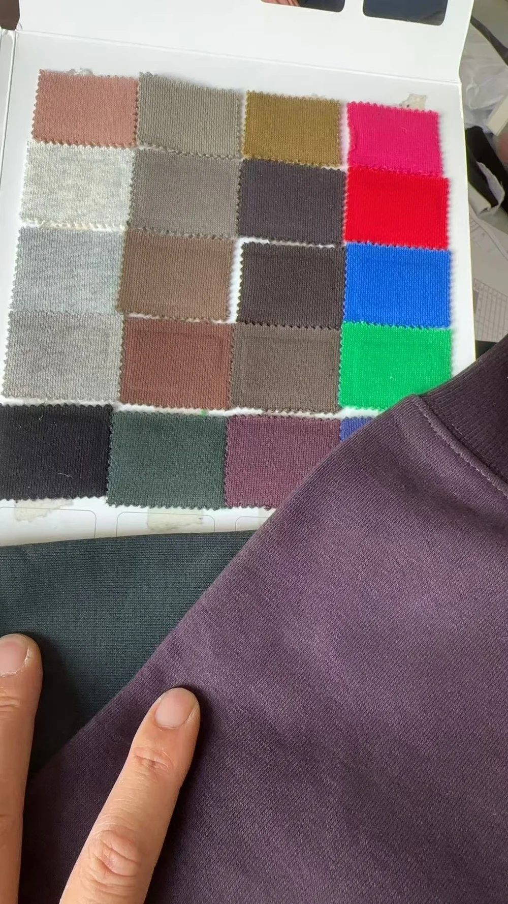 Comparing garment fabric against a colour swatch range