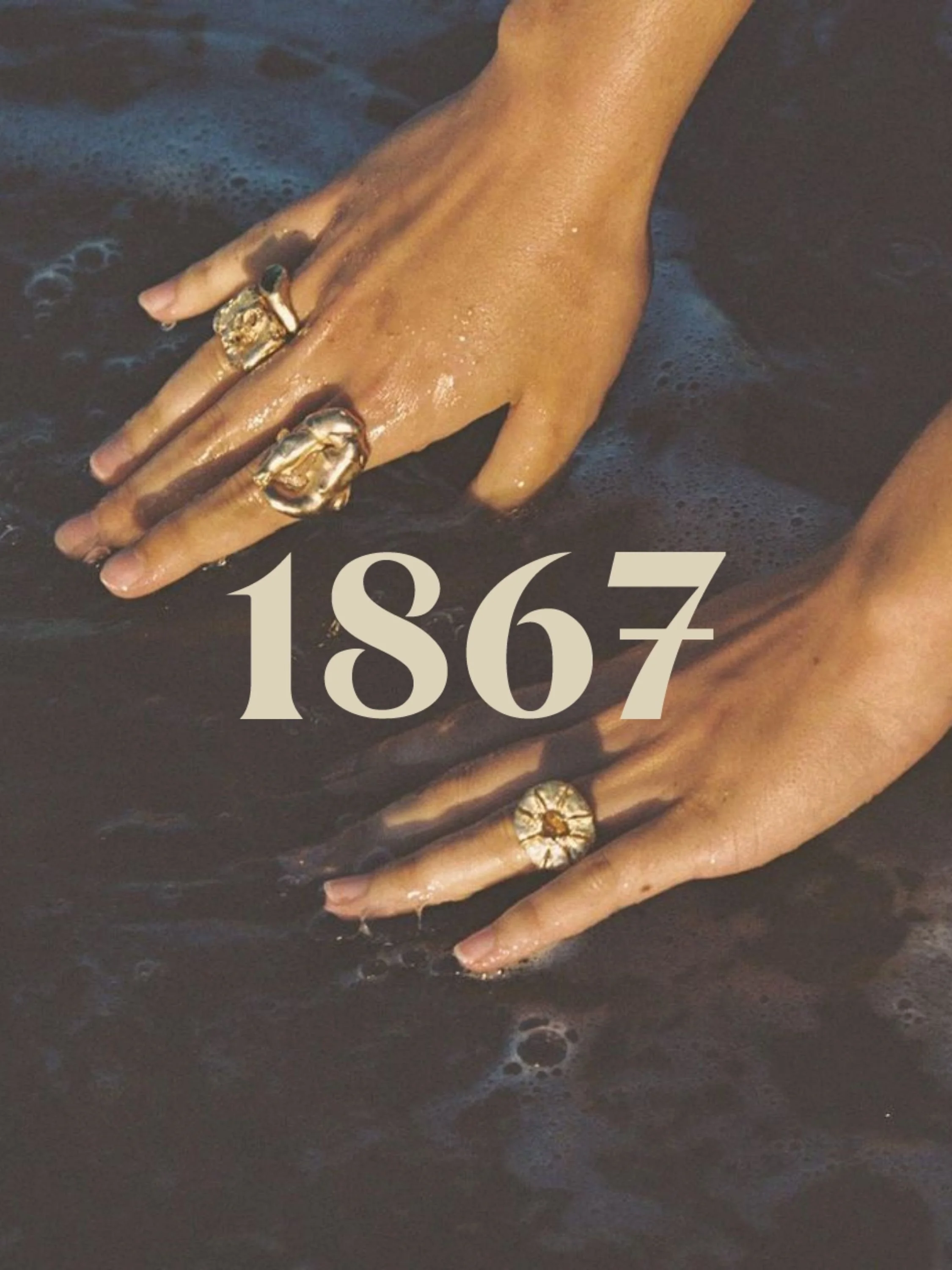 Two hands with rings submerged in water, with the number 1867 overlaid.
