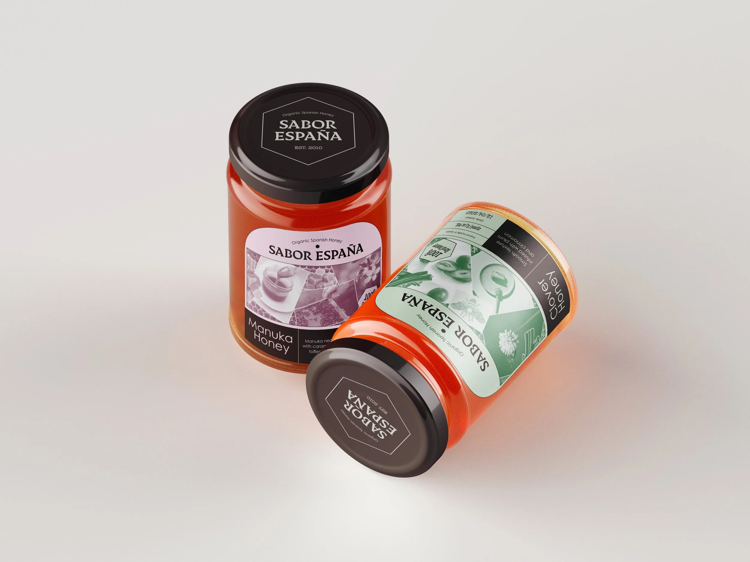 Two jars of honey with black lids, labeled 'Sabor España' and 'Manuka Honey', placed on a white surface.