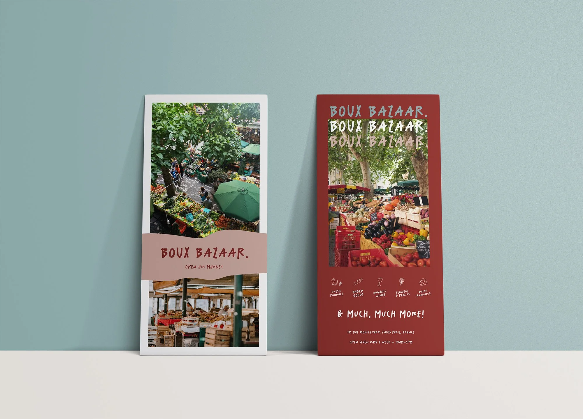 Two vertical banners promoting BOUX BAZAAR, an open-air market. The left banner features a photo of a green outdoor market scene with stalls and umbrellas, and text reading 'BOUX BAZAAR. OPEN AIR MARKET.' The right banner displays a vibrant market wi