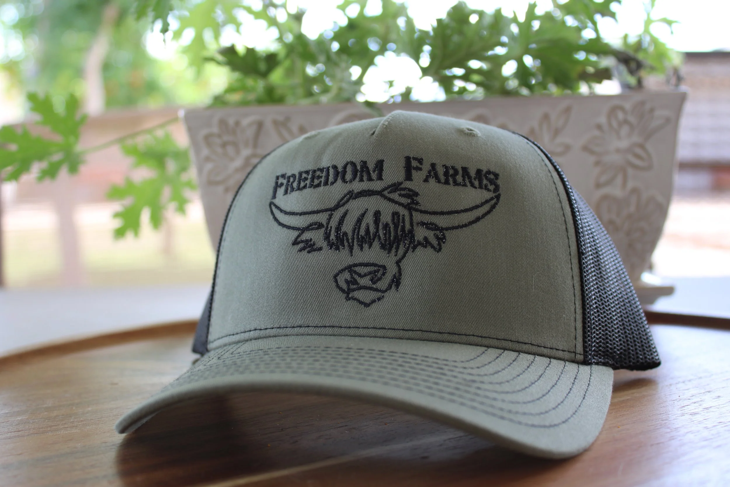 Freedom Farms Signature Trucker Hat- Army green hat with Black logo