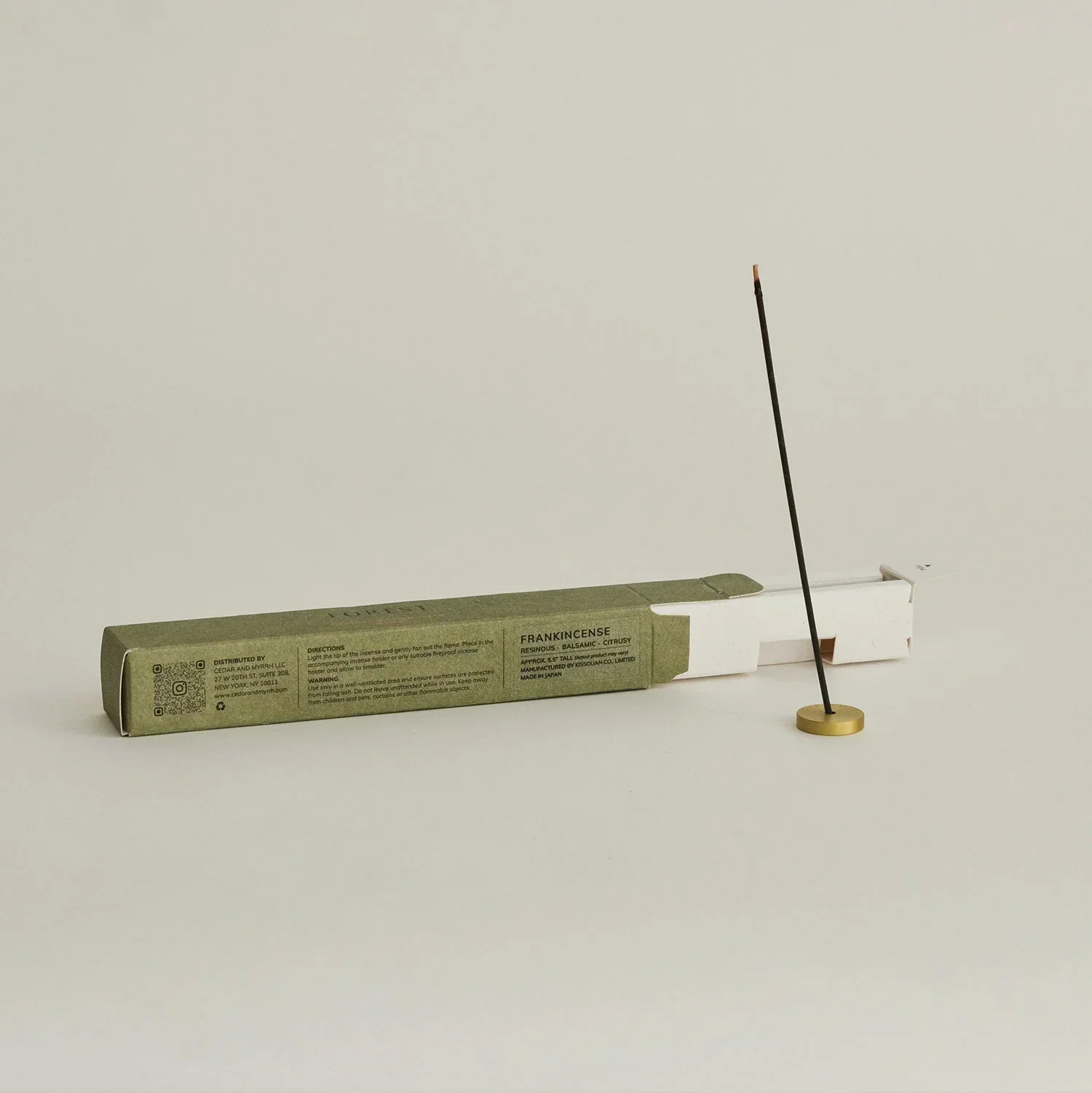 frankincense_incense_with_a_brass_holder.webp