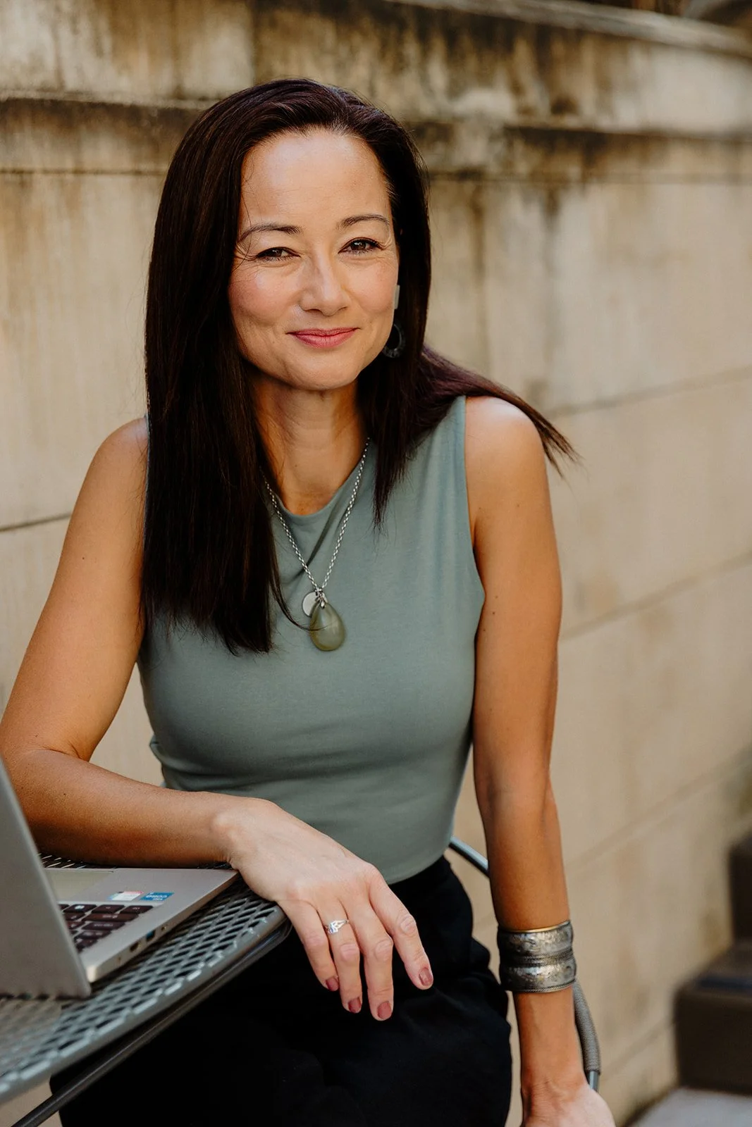 white-jade-holistic-health-founder-melissa-bergin-smiling-nature-background-mind-body-medicine-sydney-new-south-wales-cropped