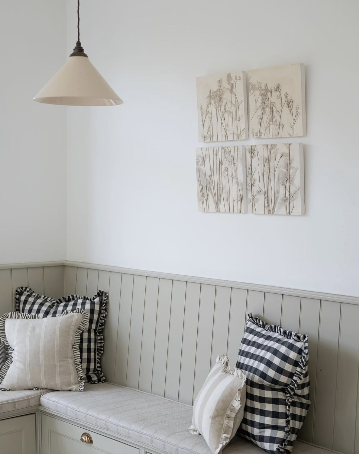Botanical plaster cast panel quartet hanging in an interior setting in neutral colours