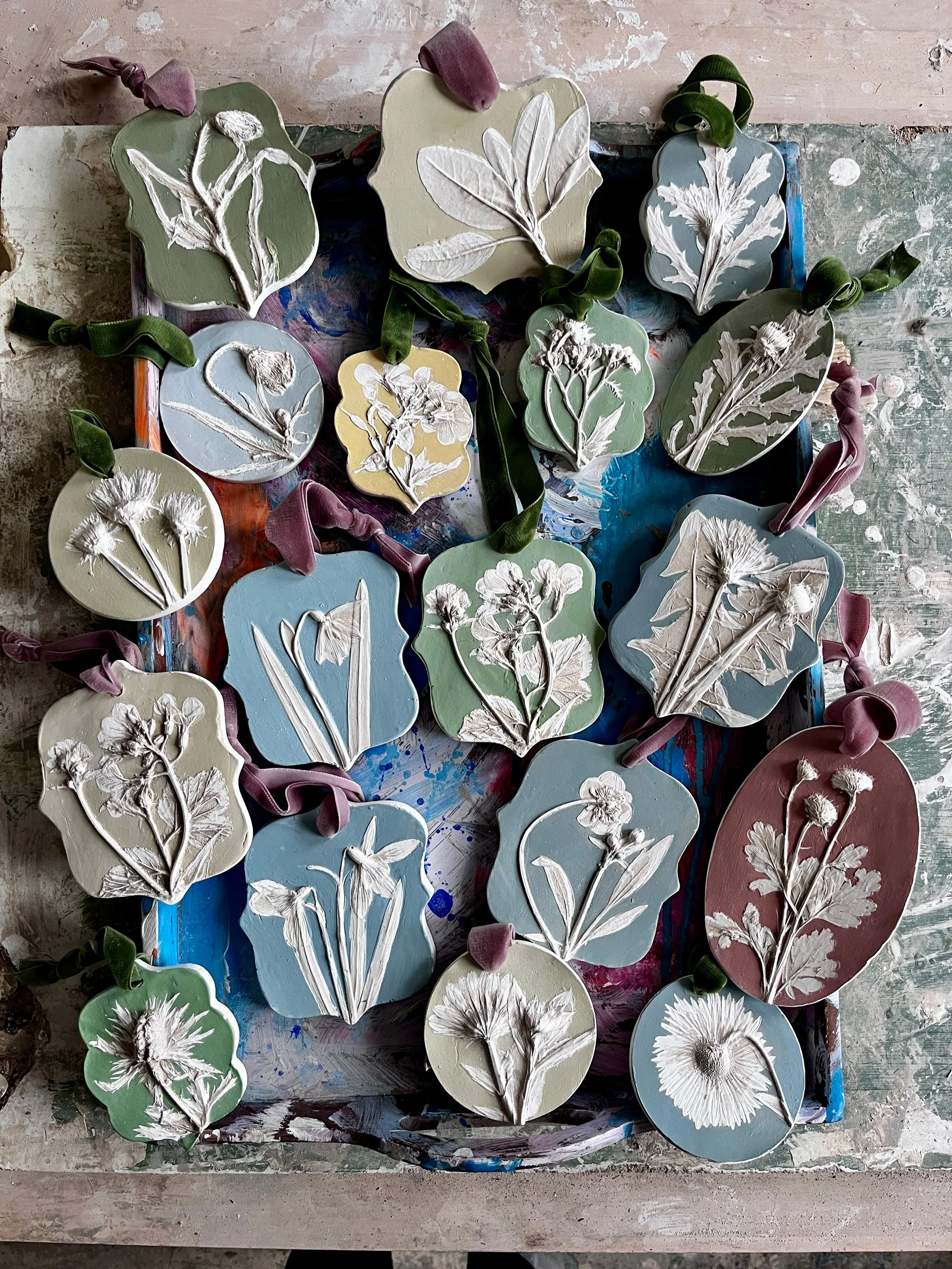 Botanical plaster casts to hang on a ribbon as part of wedding flower commissions by Imprint Casts