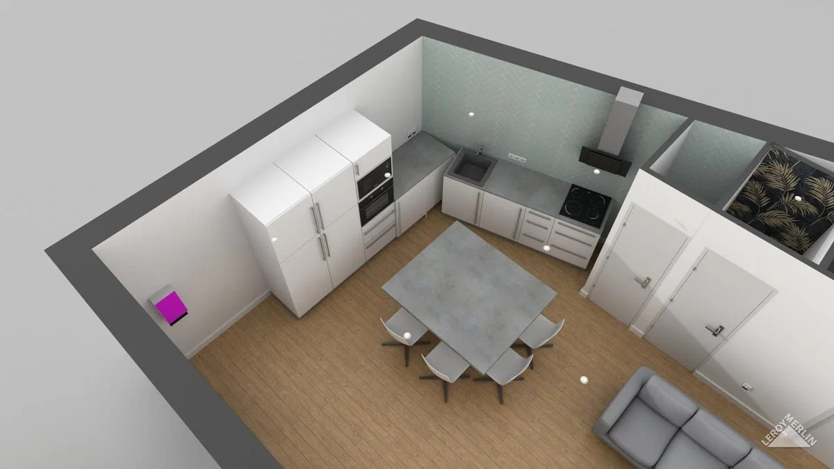 Cuisine moderne avec une table à manger, des chaises, un réfrigérateur, un four, une plaque de cuisson et un canapé gris.