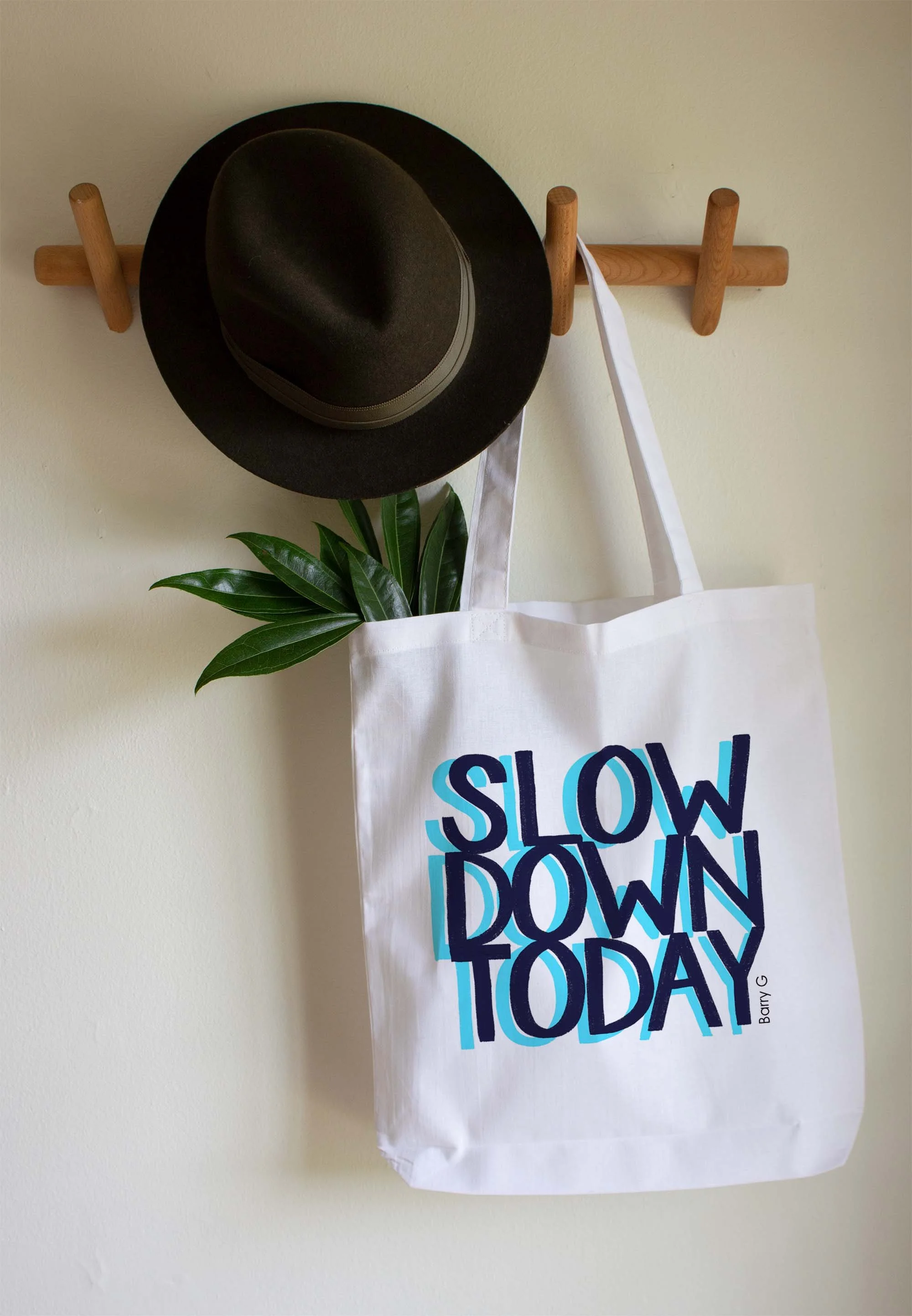 Custom artwork for Merch "SLOW DOWN TODAY" on a tote bag