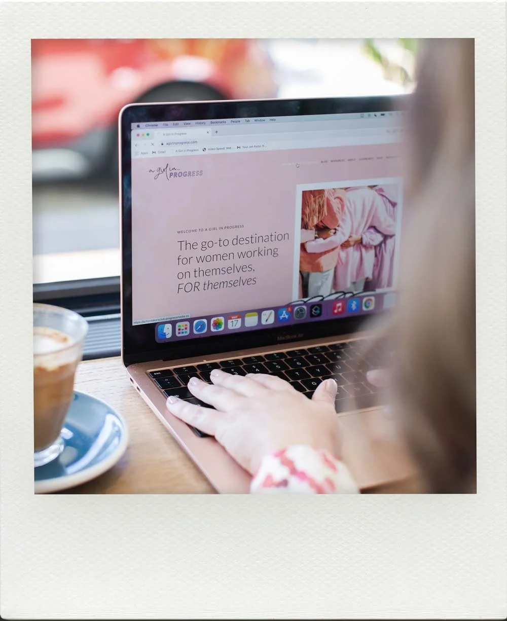 Emma Clark-Norris on her laptop working on her own digital publication, A Girl In Progress in 2018.