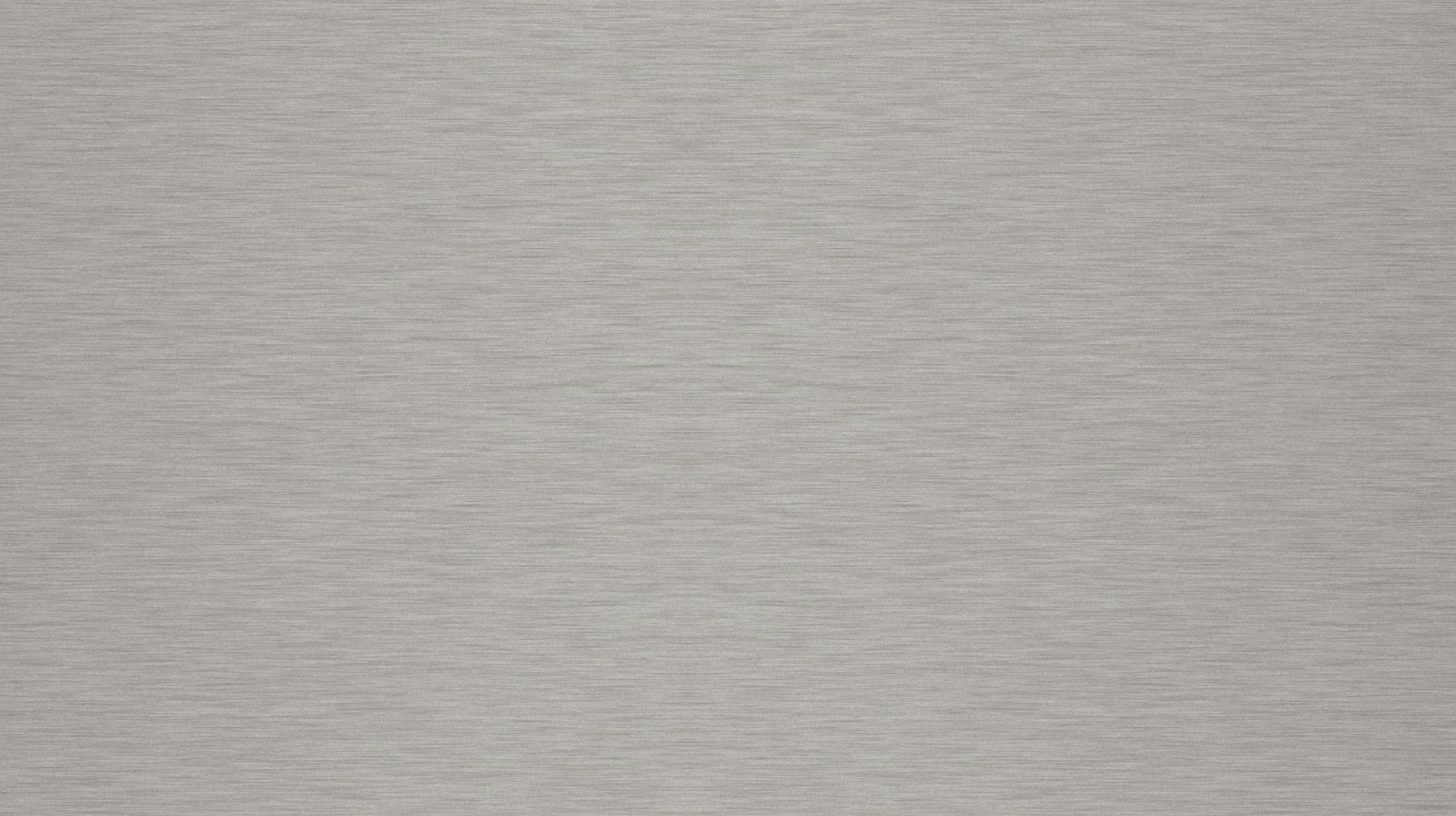 Een vlak, grijs metallic oppervlak met een fijne, horizontale textuur.
