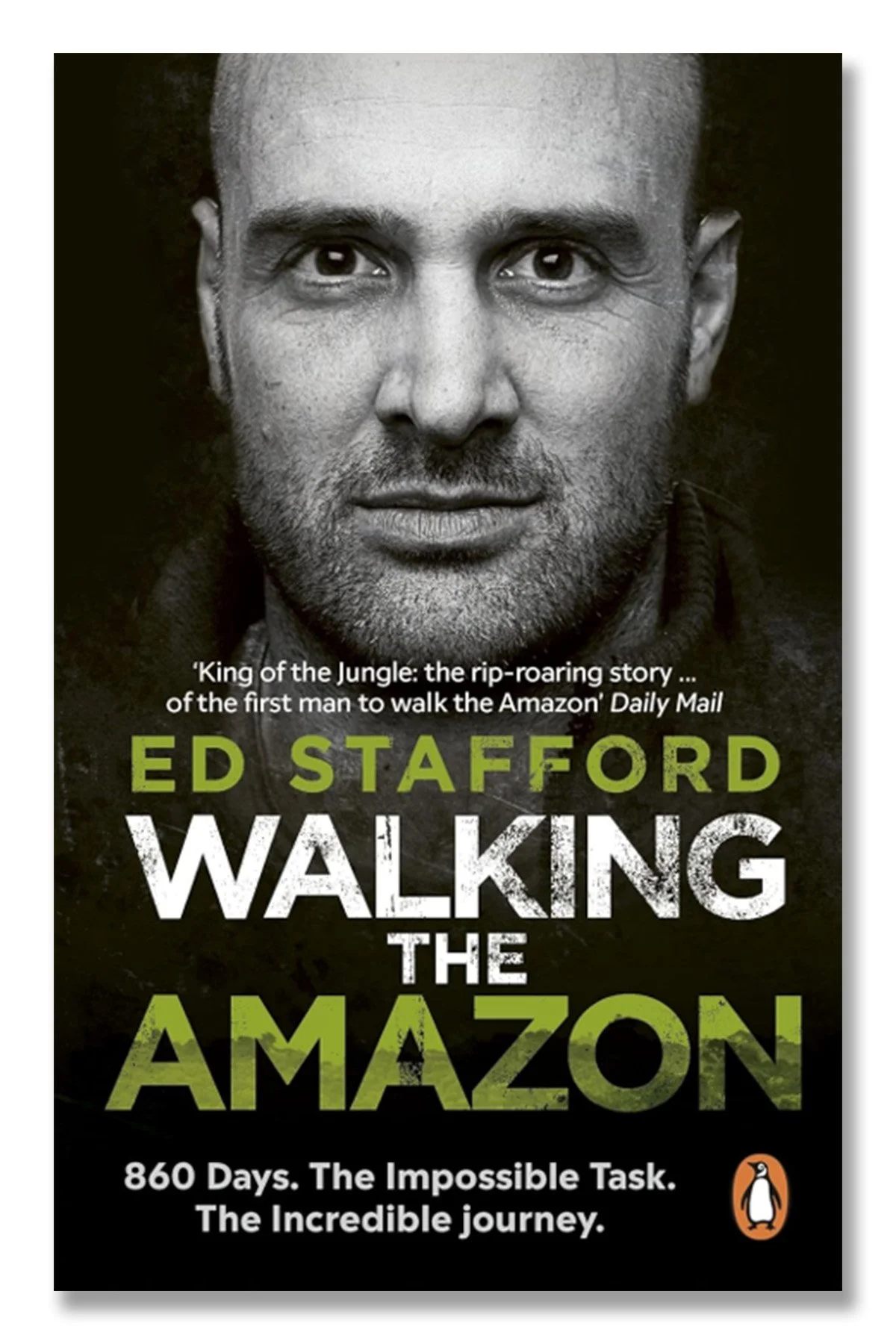 Book cover of 'Walking the Amazon' by Ed Stafford, featuring a black-and-white close-up photograph of a man's face, with the title and author’s name in bold text, and the Penguin logo at the bottom right.