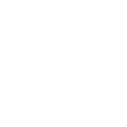 Two graduation graduates celebrating, raising their hands in the air.