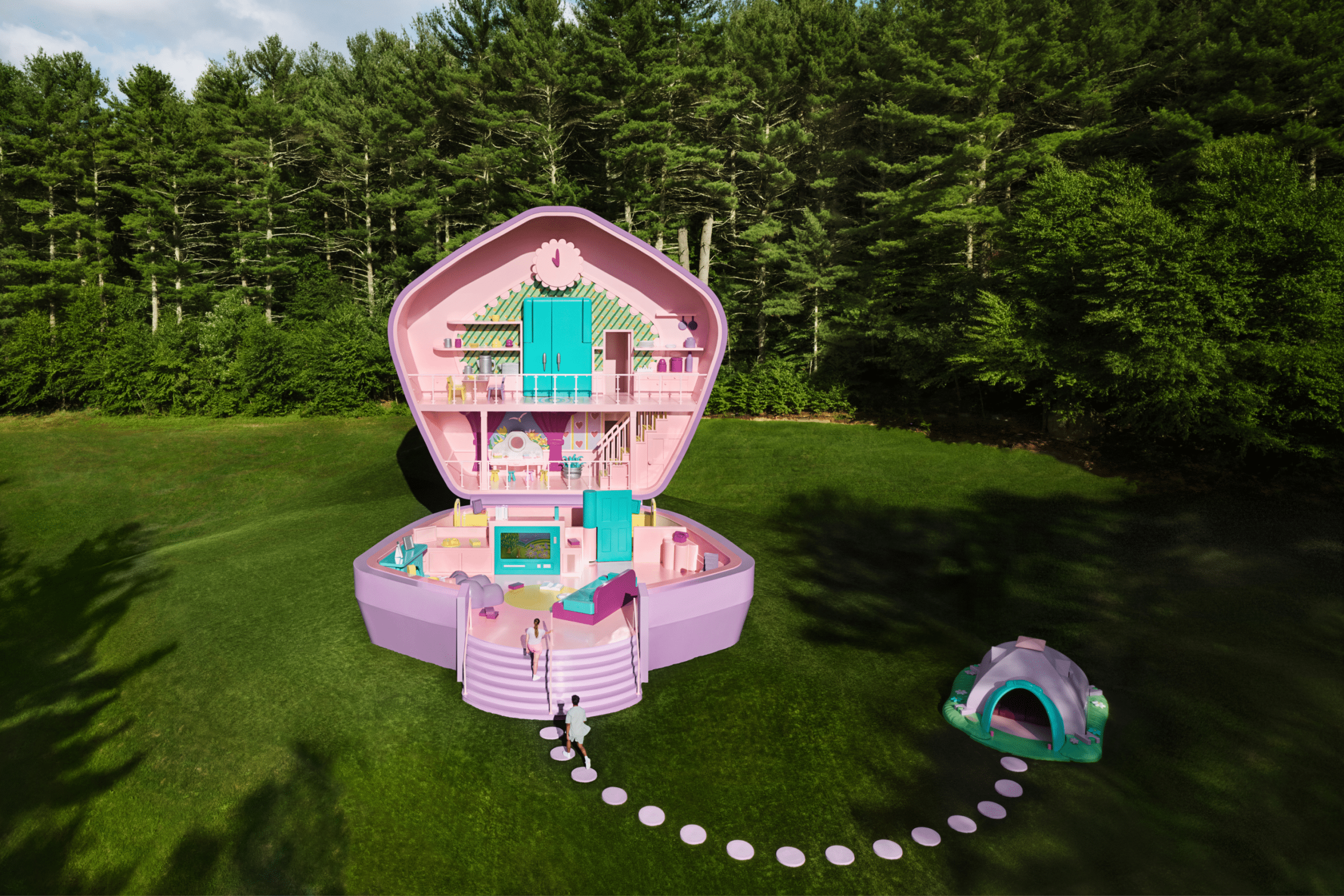 Life-size Polly Pocket dollhouse pop-up in a lush forest setting for Airbnb brand activation, featuring bright pink and purple interiors and visitors entering the toy-inspired experience.