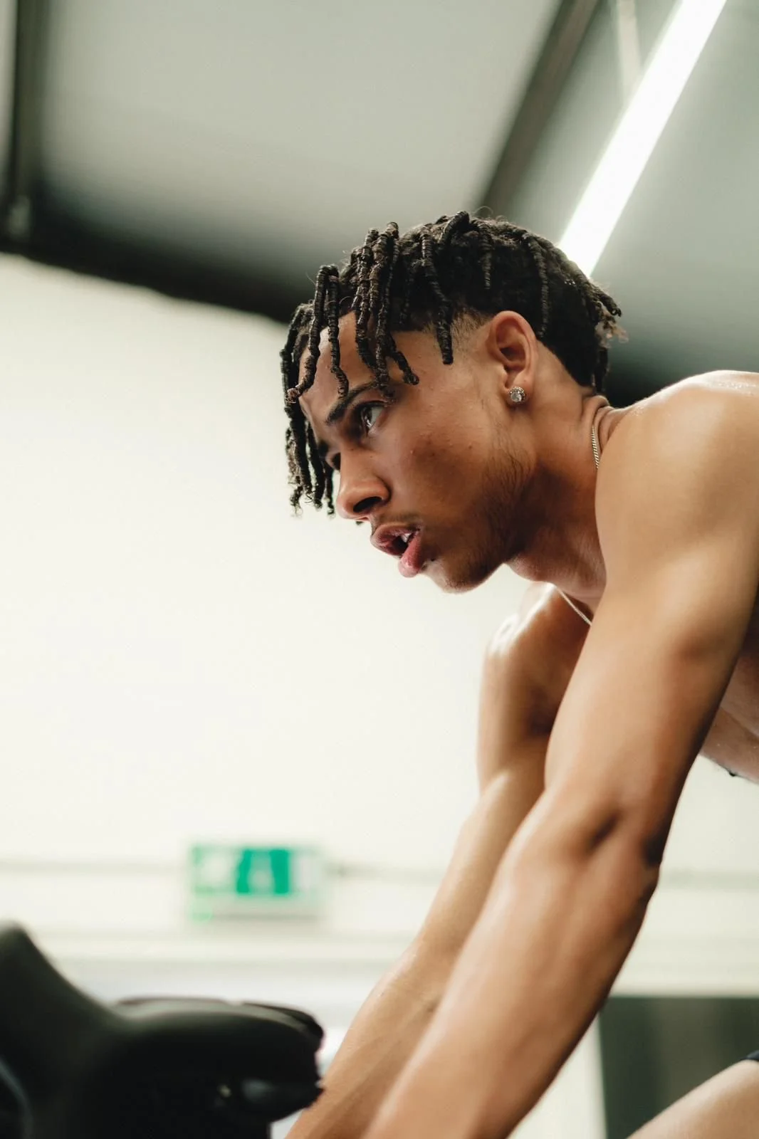 sports physiotherapist coaching Romelle Donavon (young professional footballer) through strength and conditioning for performance.