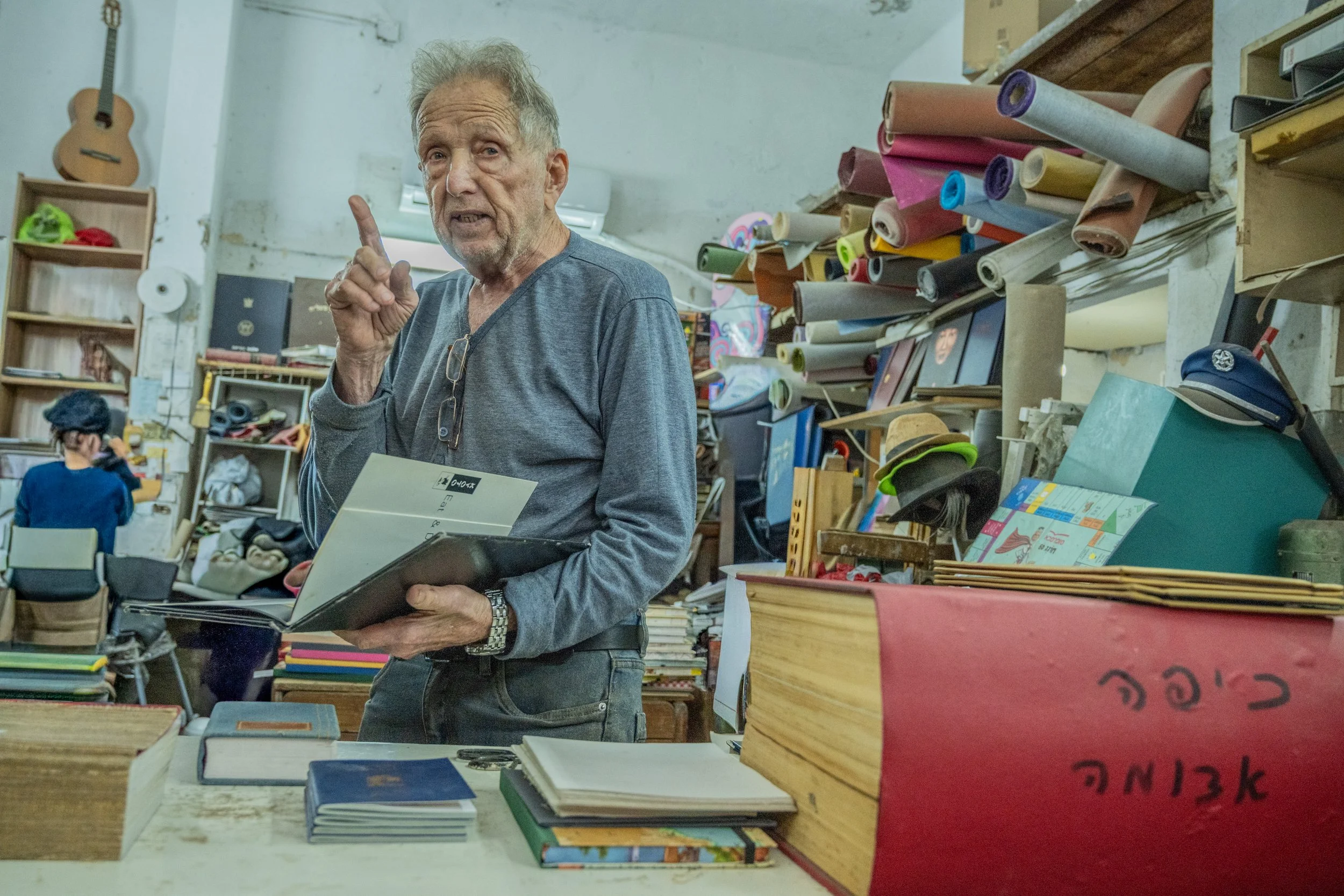 Bookbinder Shalom Zimber standing in his shop