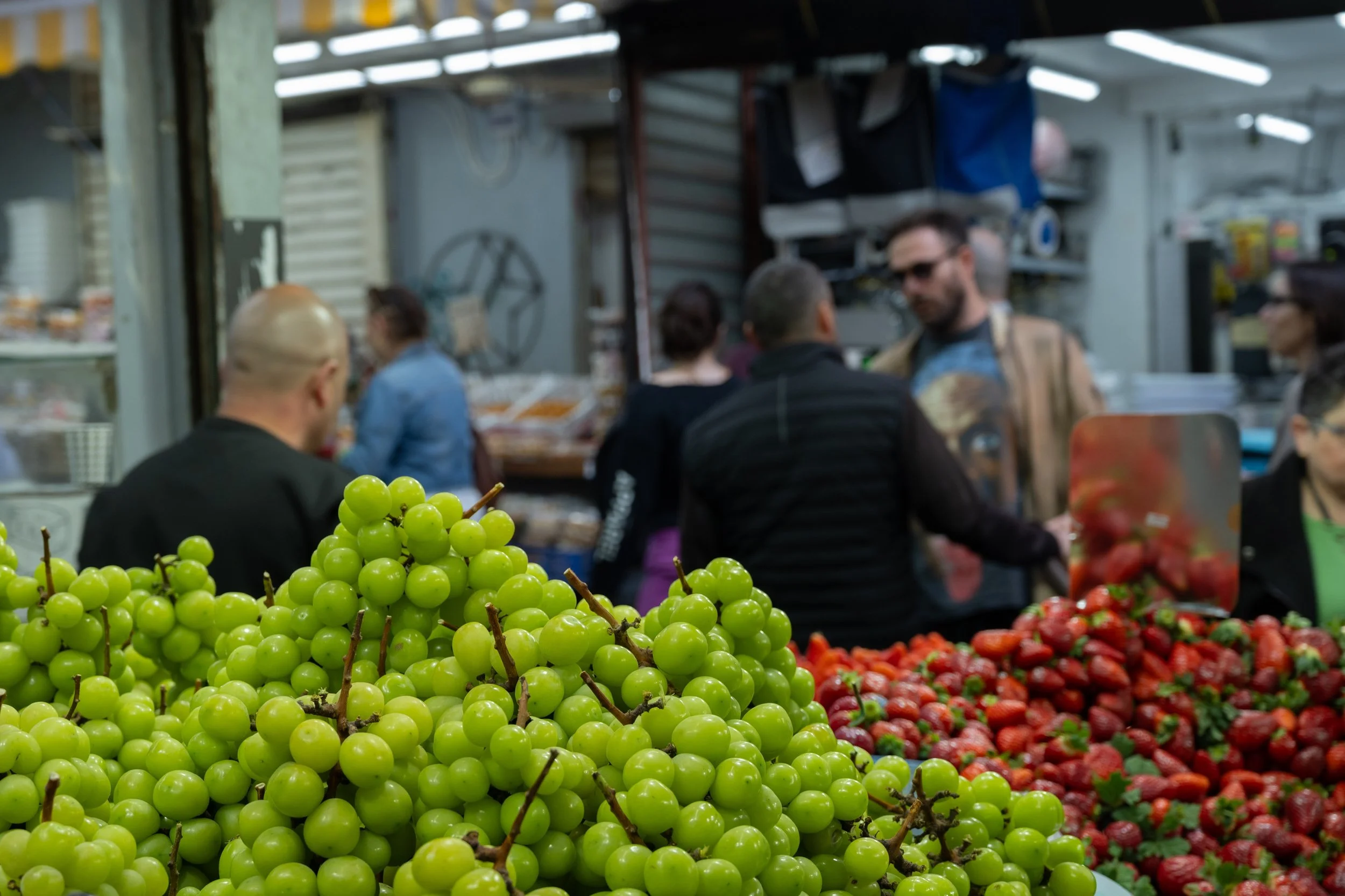 Fresh vegetables displayed at a market stall in Carmel Market, Tel Aviv