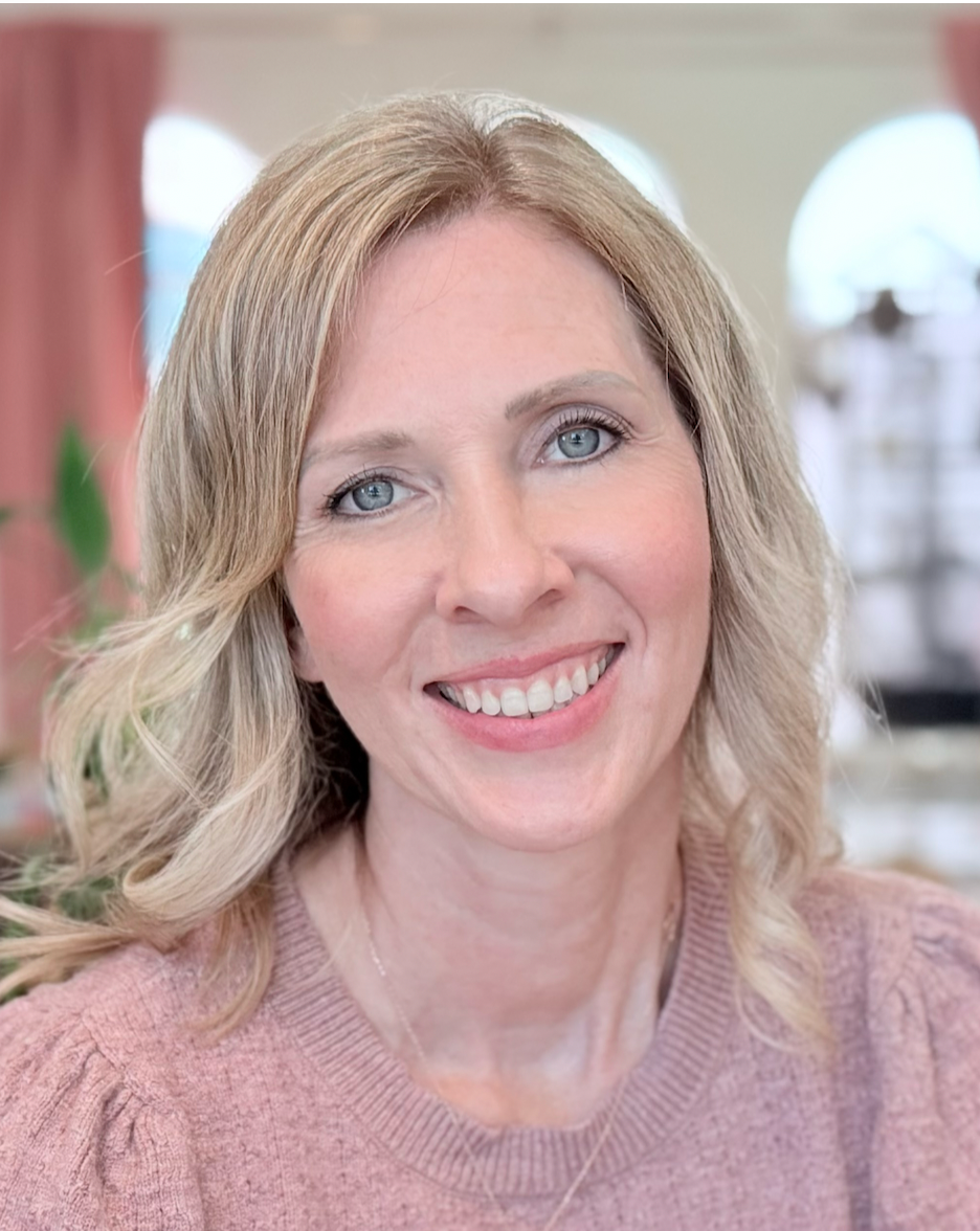 Portrait of Tiffany Liddell, M.Ed., Woman with shoulder length blonde hair and a pink blouses smiling at the camera
