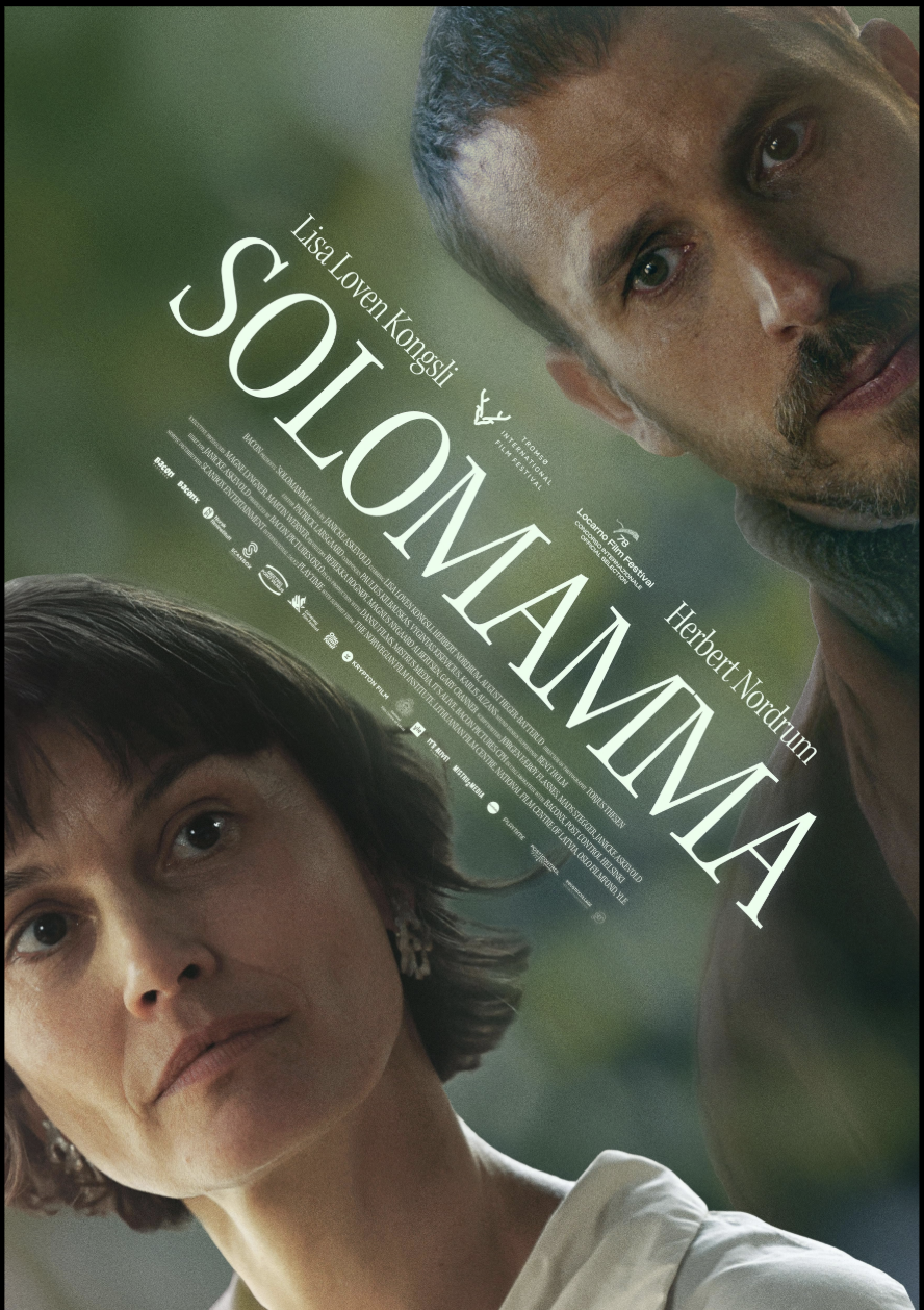 A movie poster for the film 'Solomani' featuring two main characters, a woman with short dark hair and a man with a beard and mustache, set against a green blurred background.