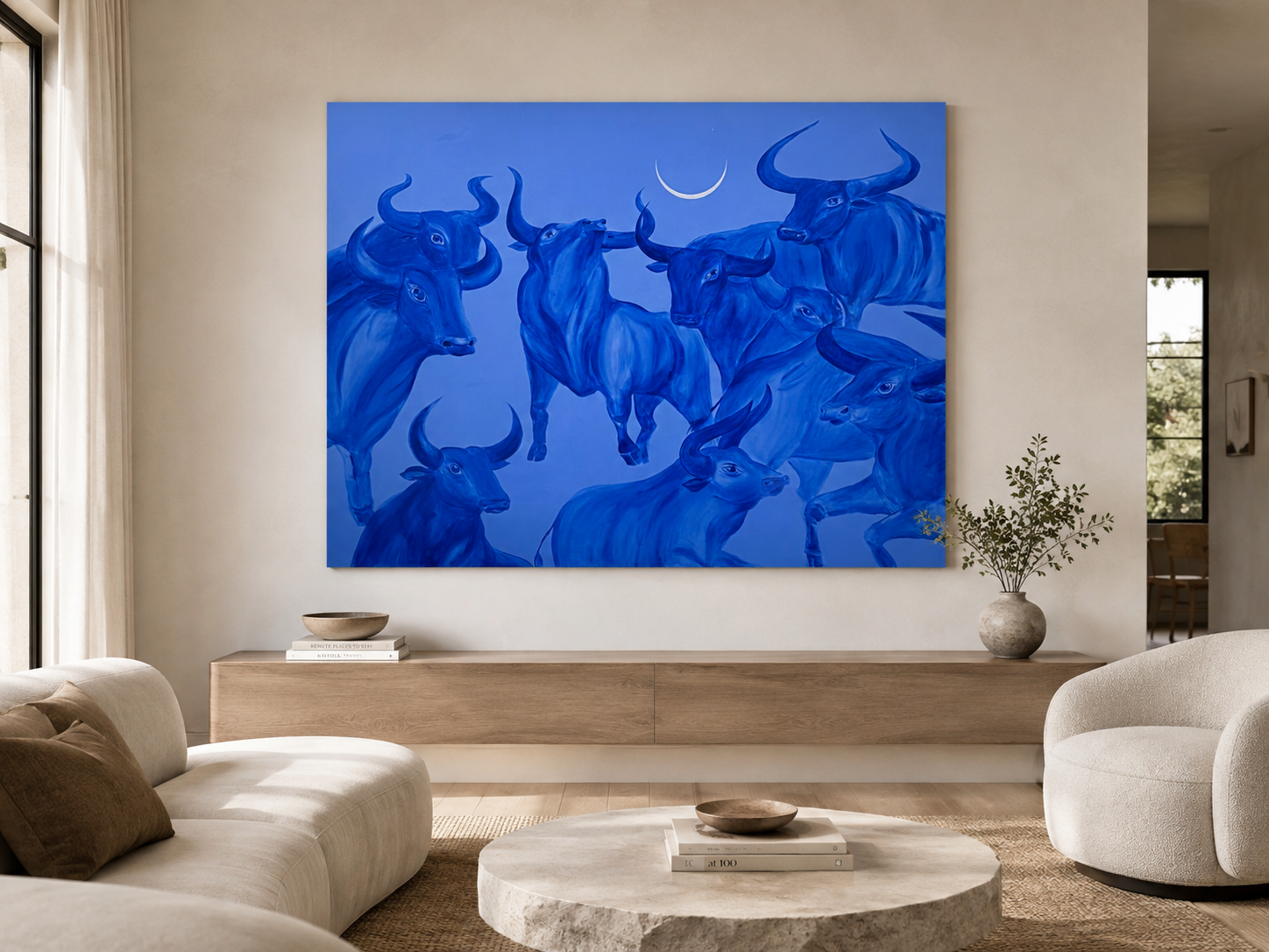 Large contemporary blue painting We Were Here Before by Jevgenia Vassiljeva, depicting a layered herd of cobalt blue bulls beneath a white crescent moon on a light blue background.