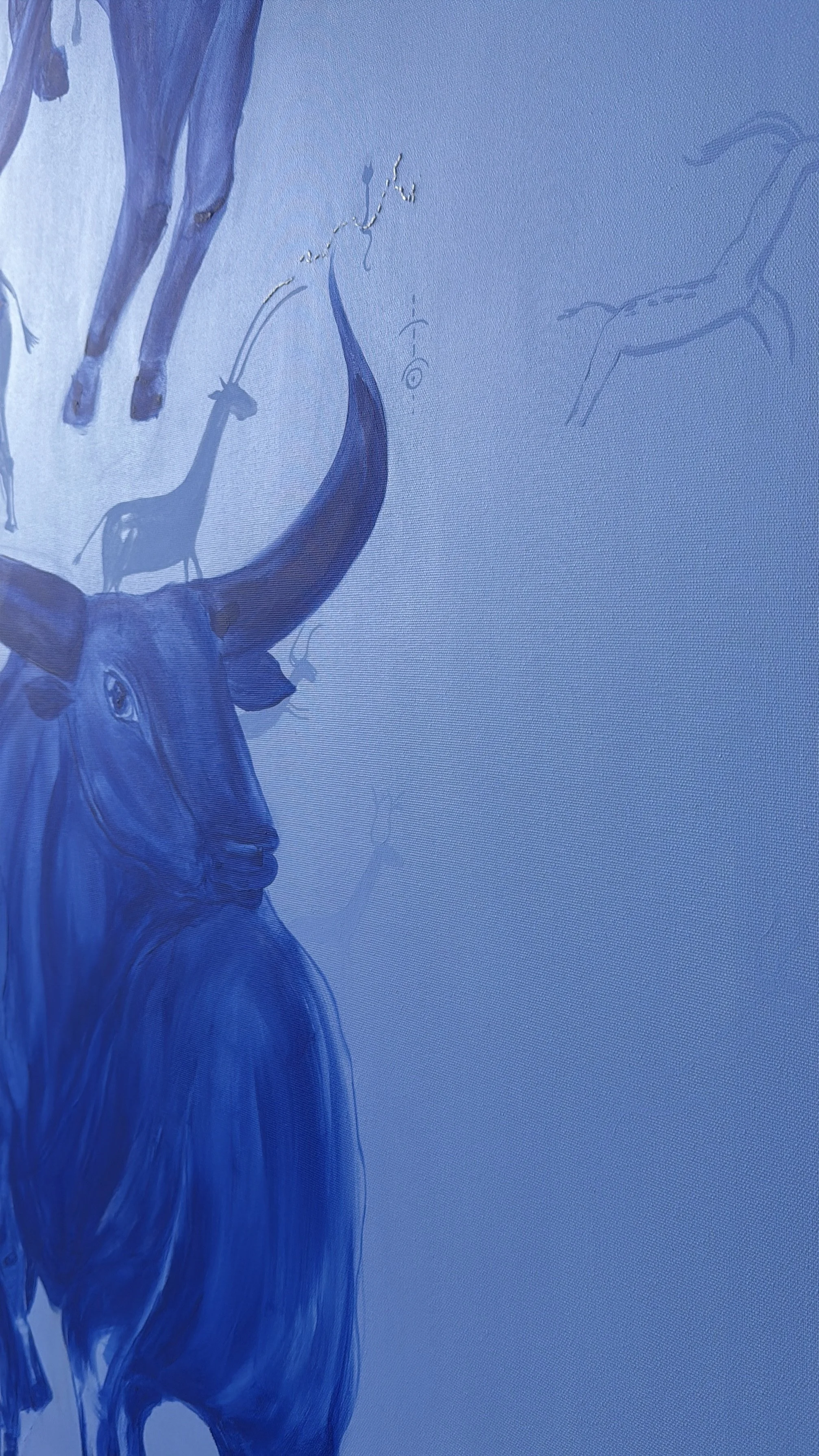Still, We Return by Jevgenia Vassiljeva, 2026 — a large 200 × 160 cm blue acrylic painting featuring an overlapping herd of bulls, hidden animal figures, embroidered details and a white crescent moon.