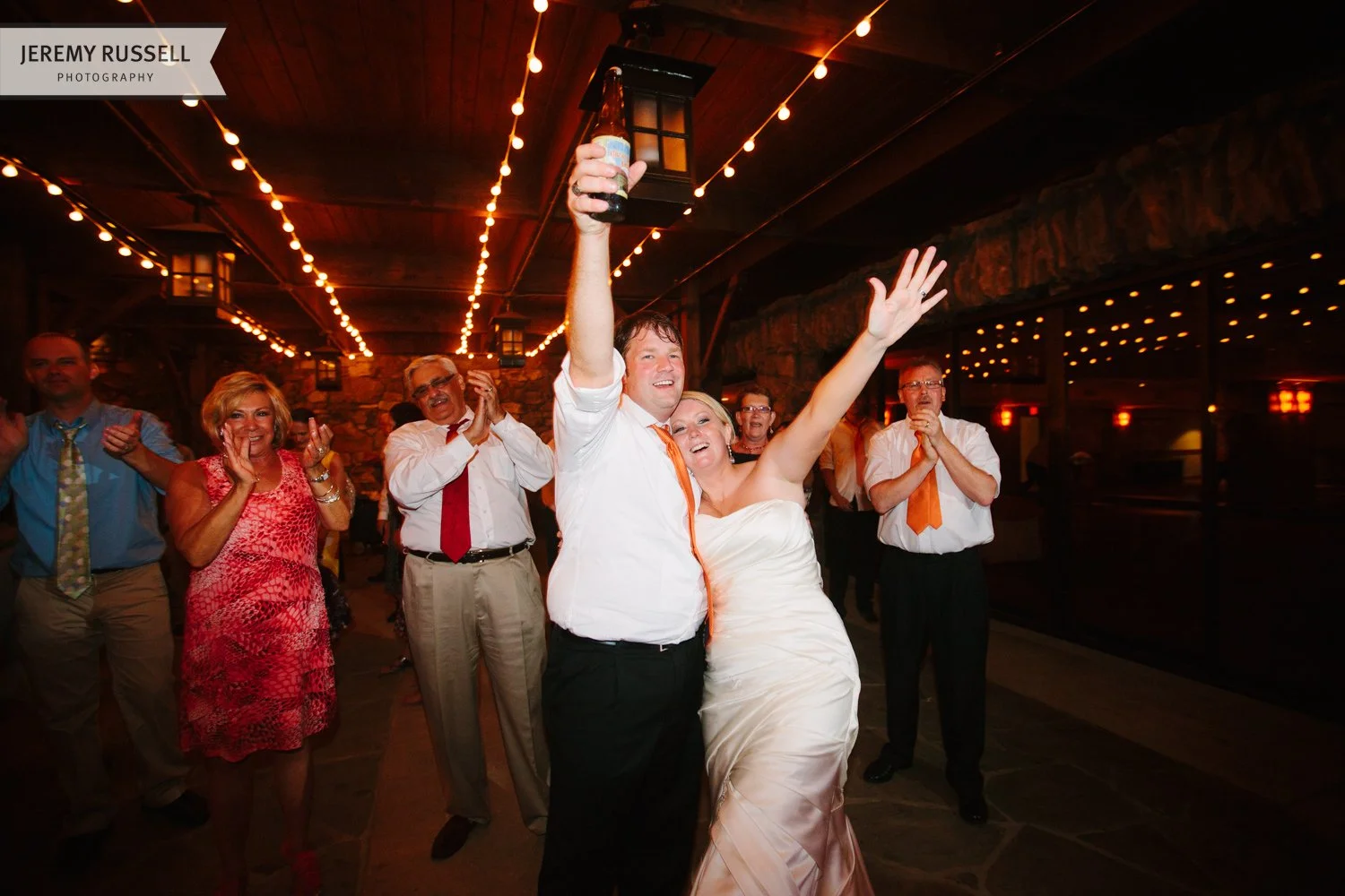 Bride and groom cheer for The Business band