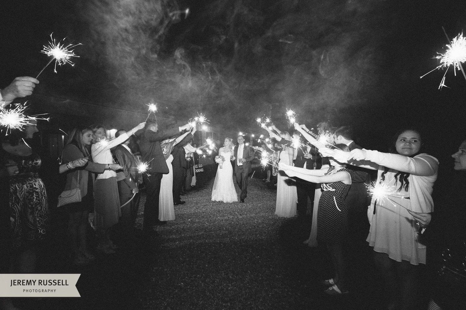 Bride and groom exit Claxton Farm​