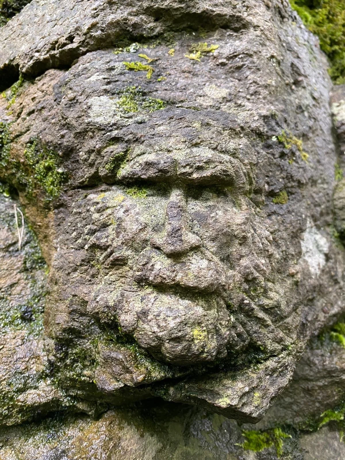 a face carved into rock