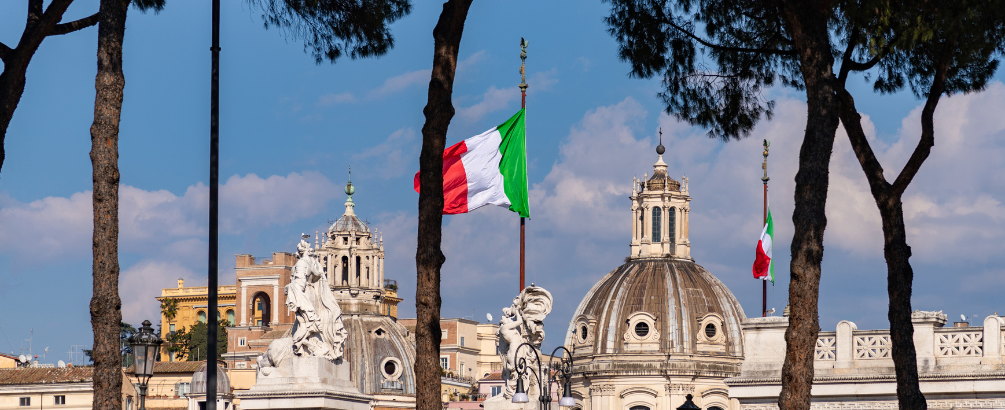 Italian flag with Rome buildings in the background