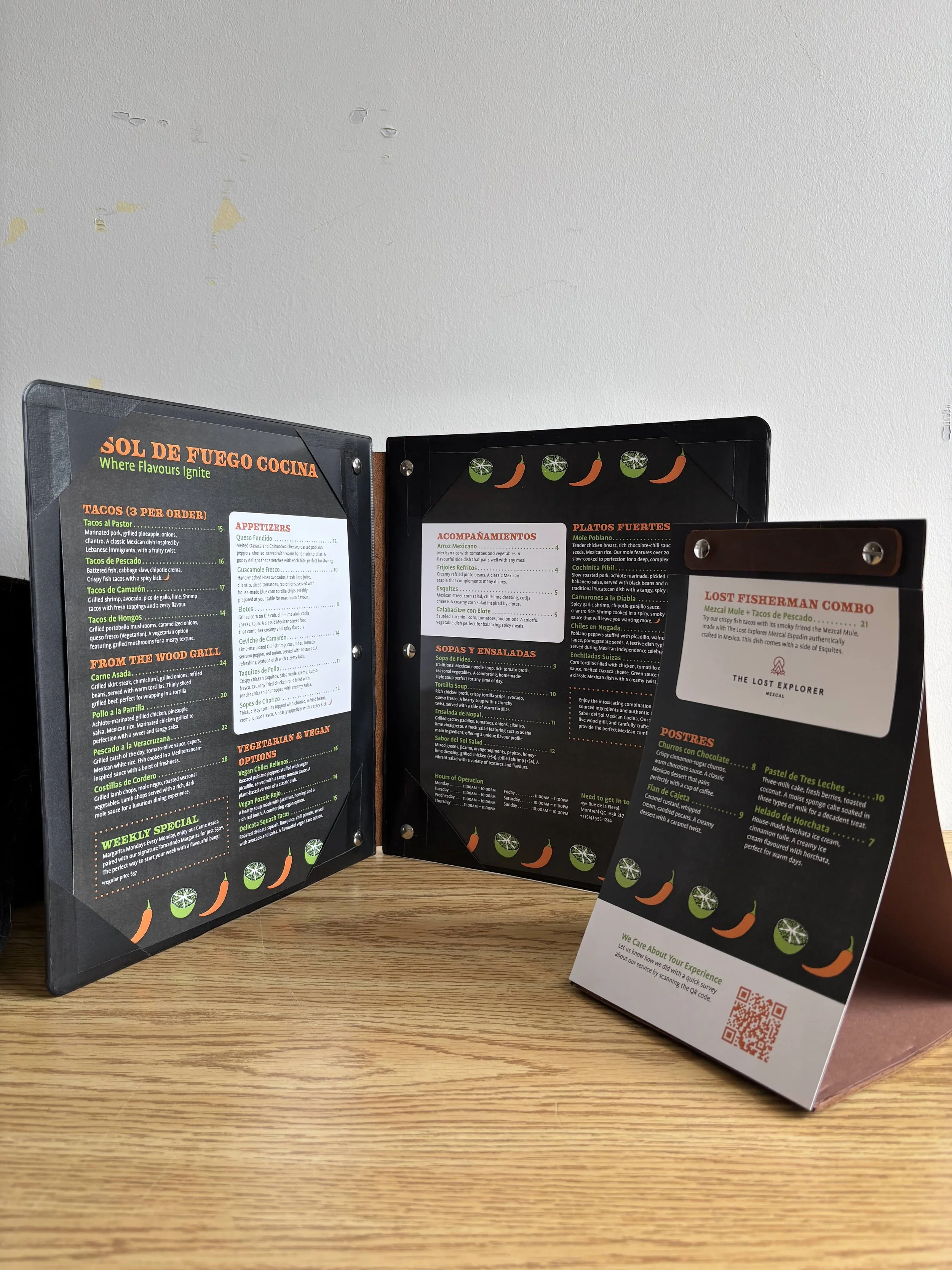 Photo of two menu designs with leather and metal finishing