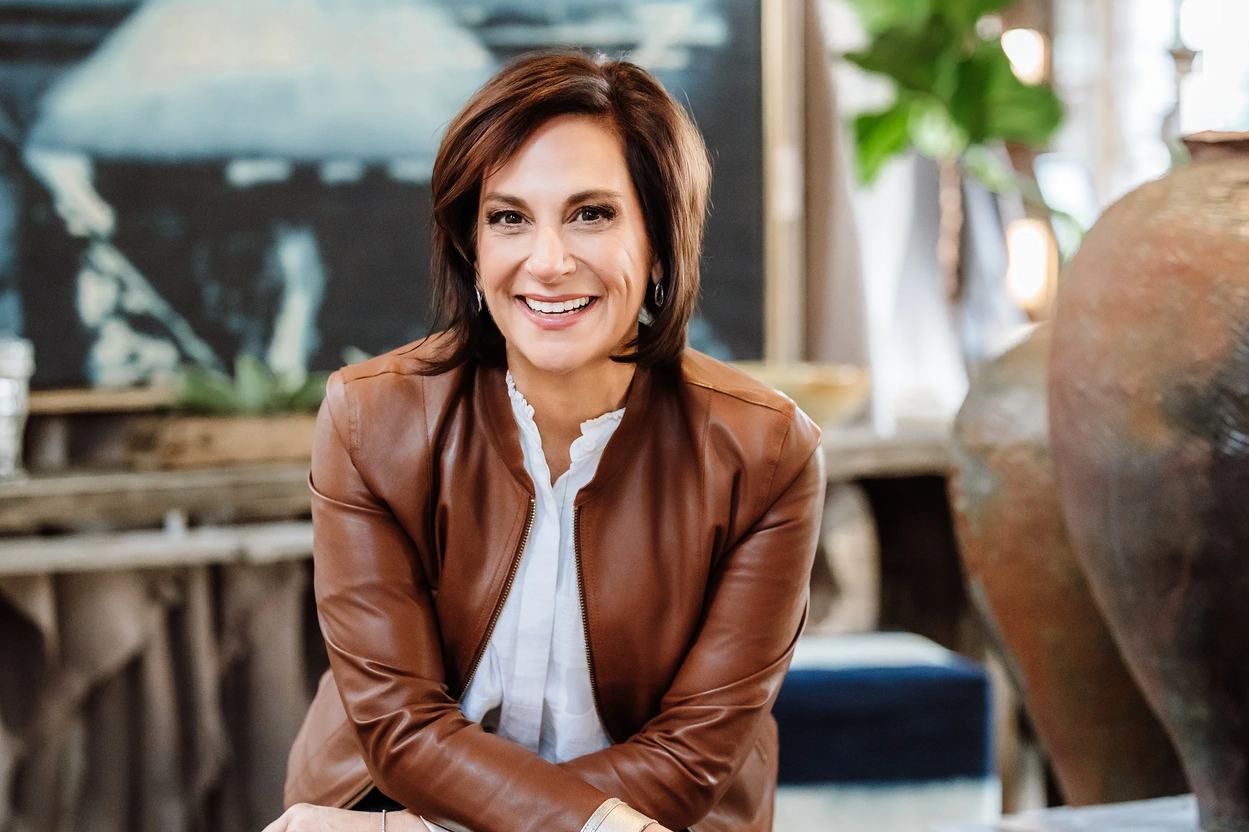 Andrea Liebross business coach and keynote speaker for women leaders brown leather jacket