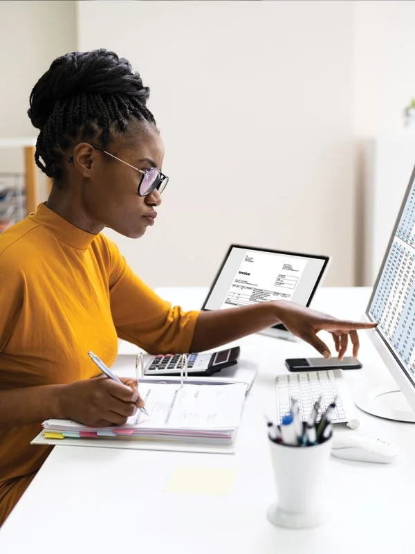 Woman business owner managing finances - stock photo