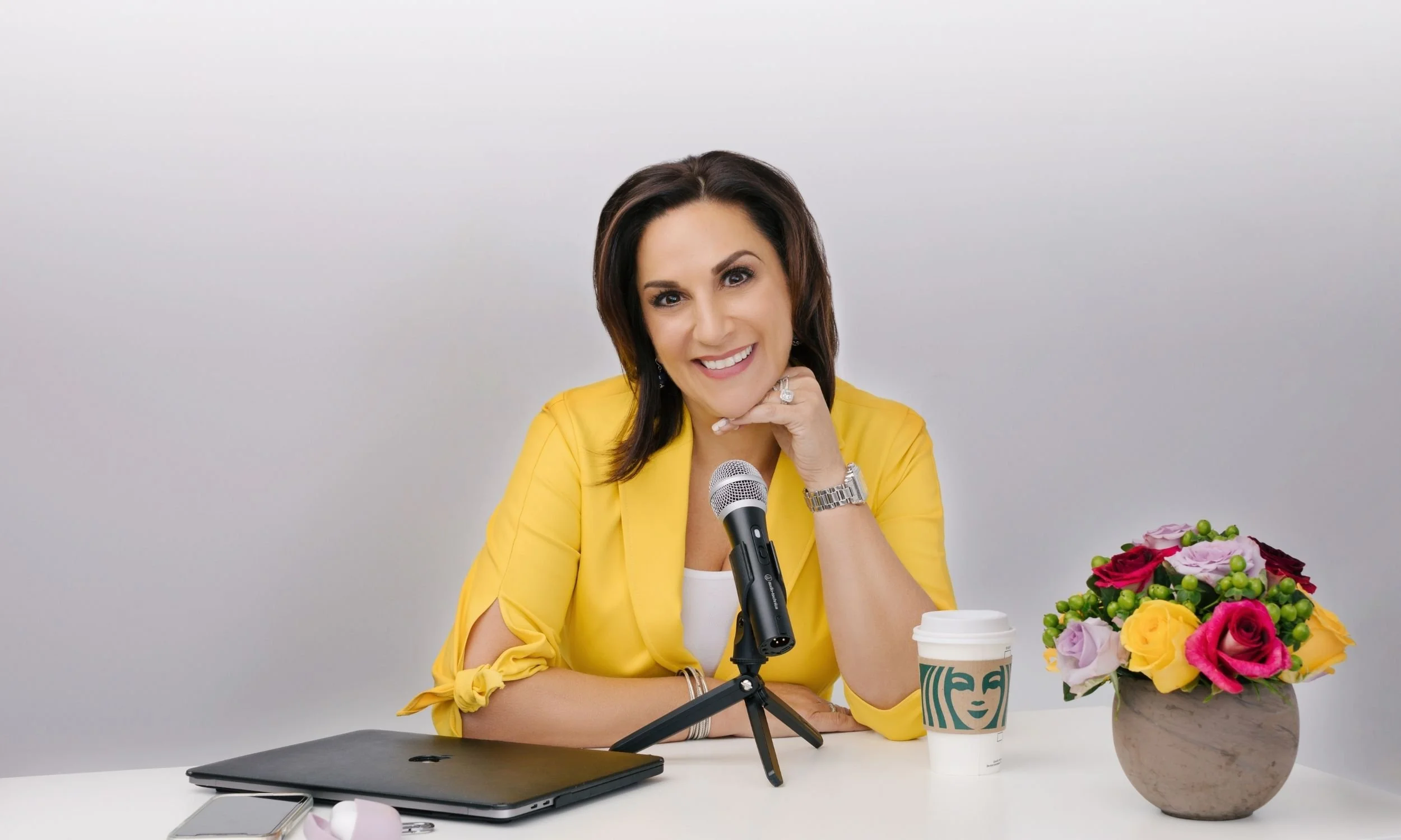 Andrea Liebross recording an episode of her podcast.