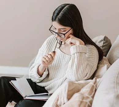 Woman business owner reading book for professional development