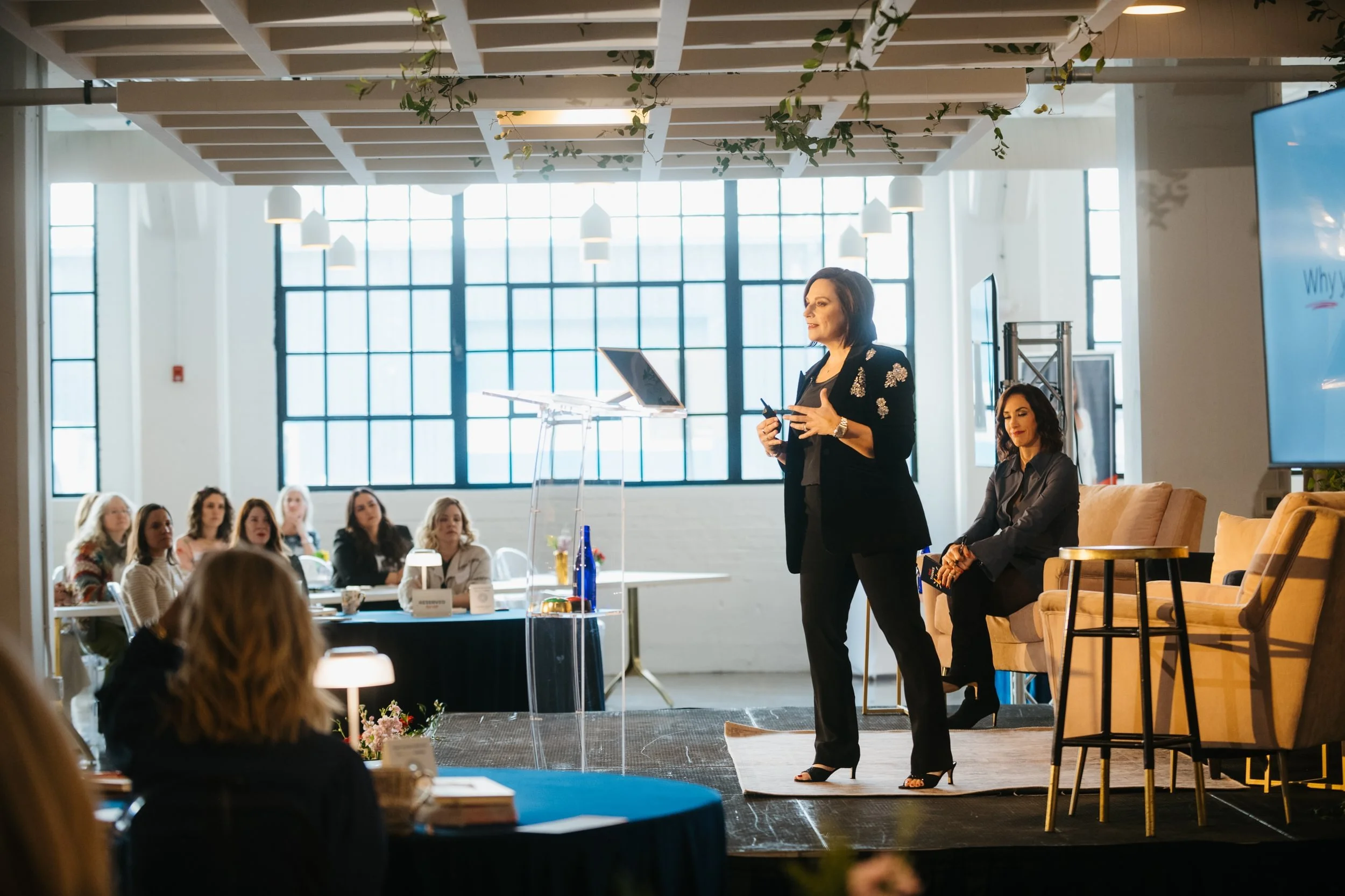 Andrea Liebross delivering keynote presentation to business leaders