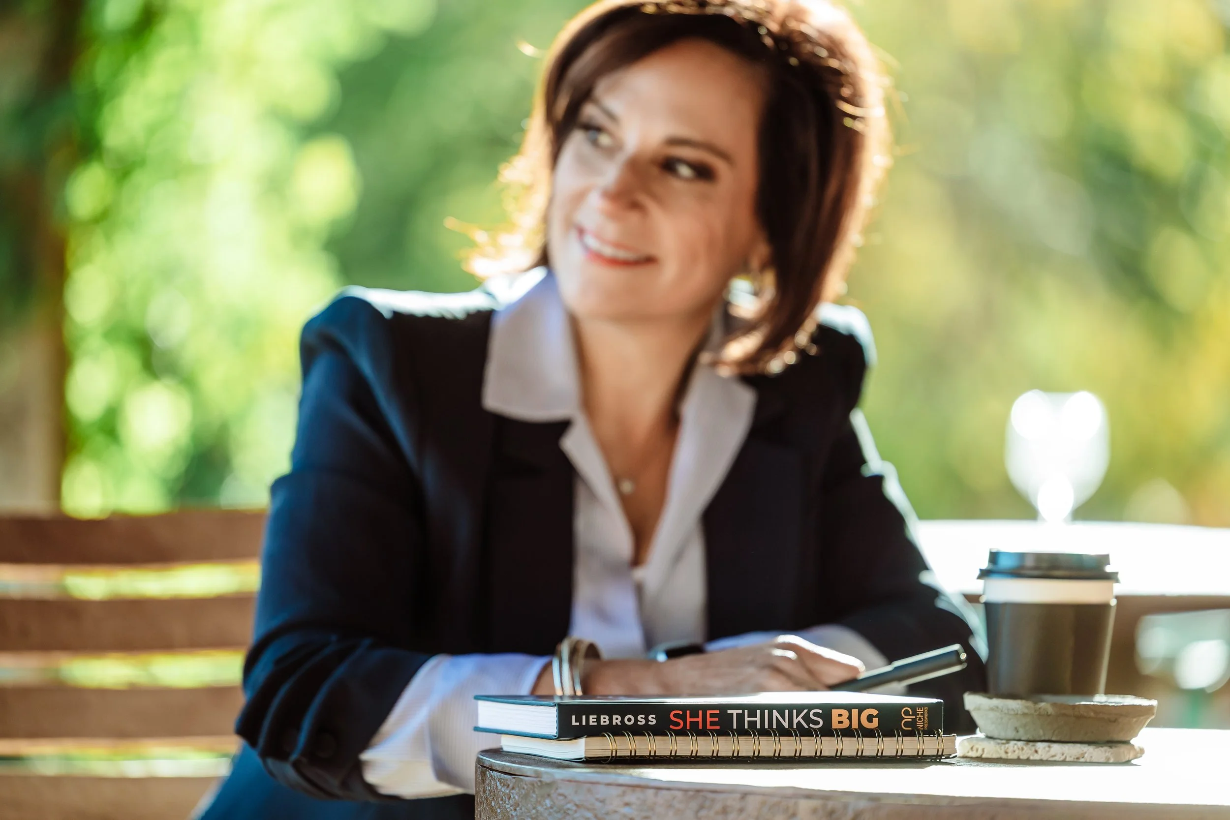 Andrea Liebross keynote speaker with She Thinks Big book