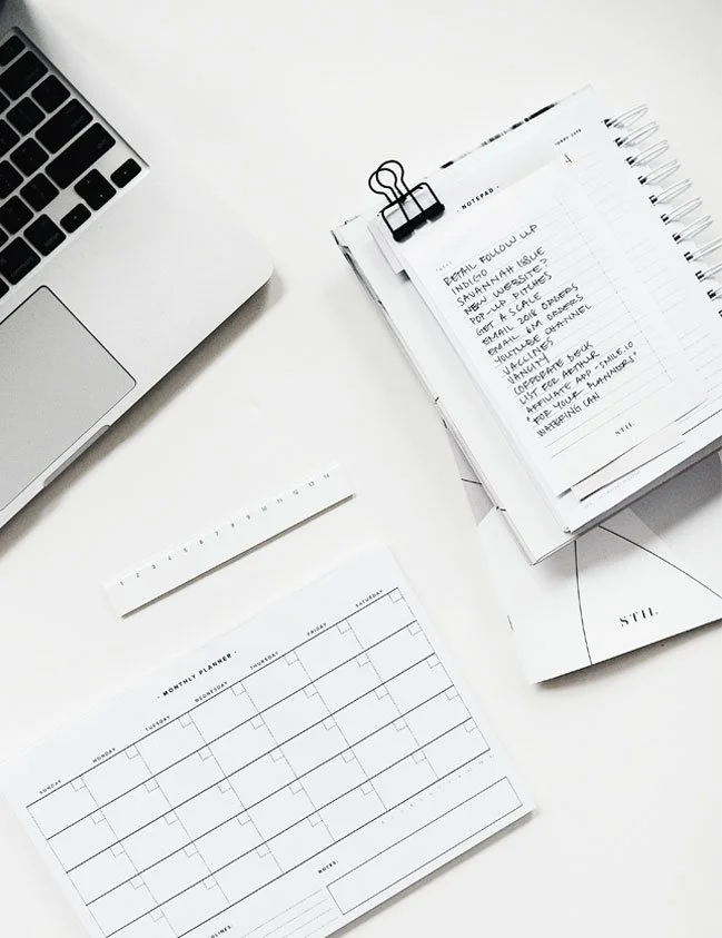 Business planning workspace with weekly planner and productivity tools