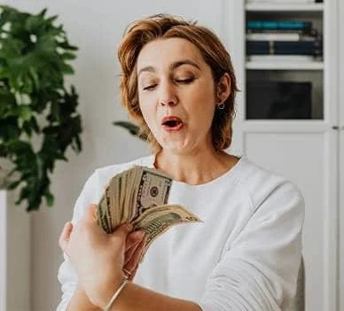 Woman business owner managing money and pricing confidence