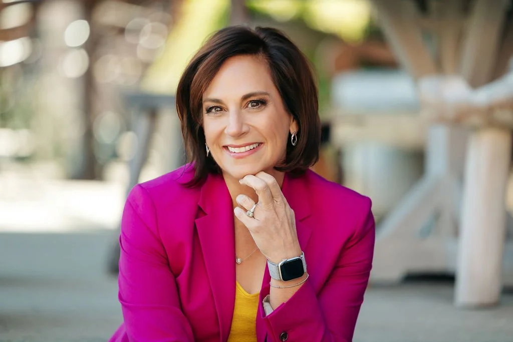 Andrea Liebross business coach and keynote speaker for women entrepreneurs pink suit