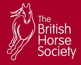 The logo of The British Horse Society, featuring a stylized white horse on a red background with the organization's name.