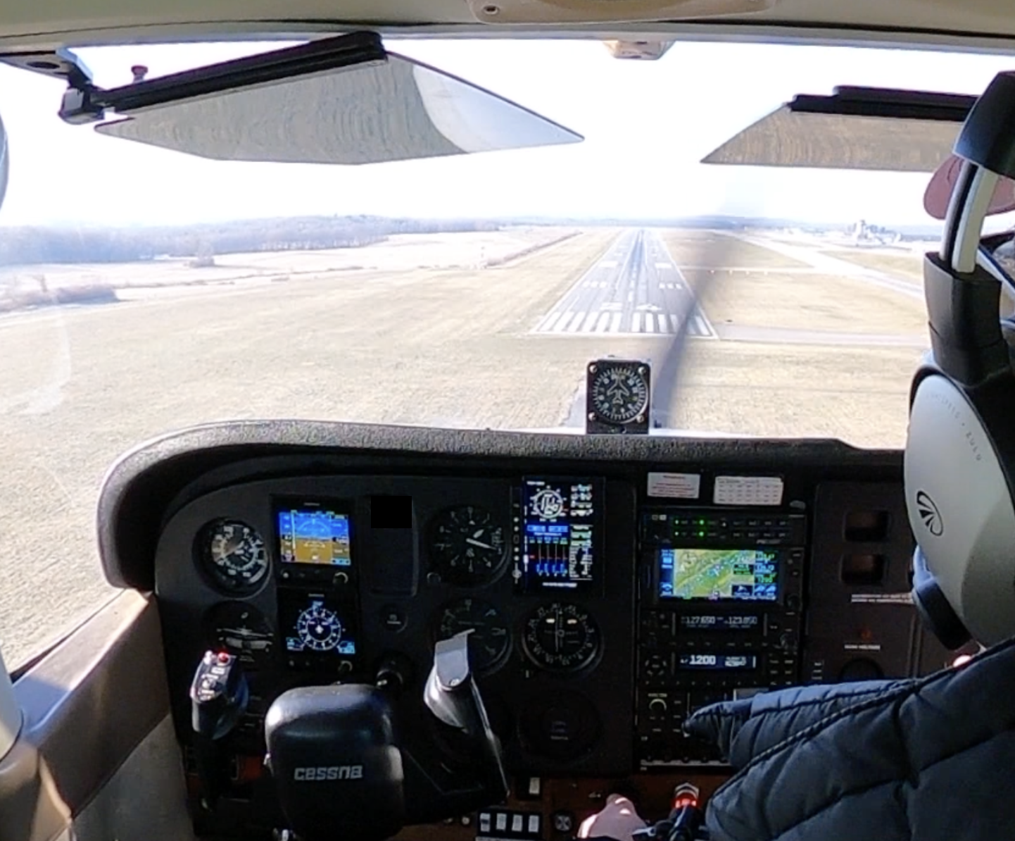 Cockpit view of Cessna 172 on short final approach to land.
