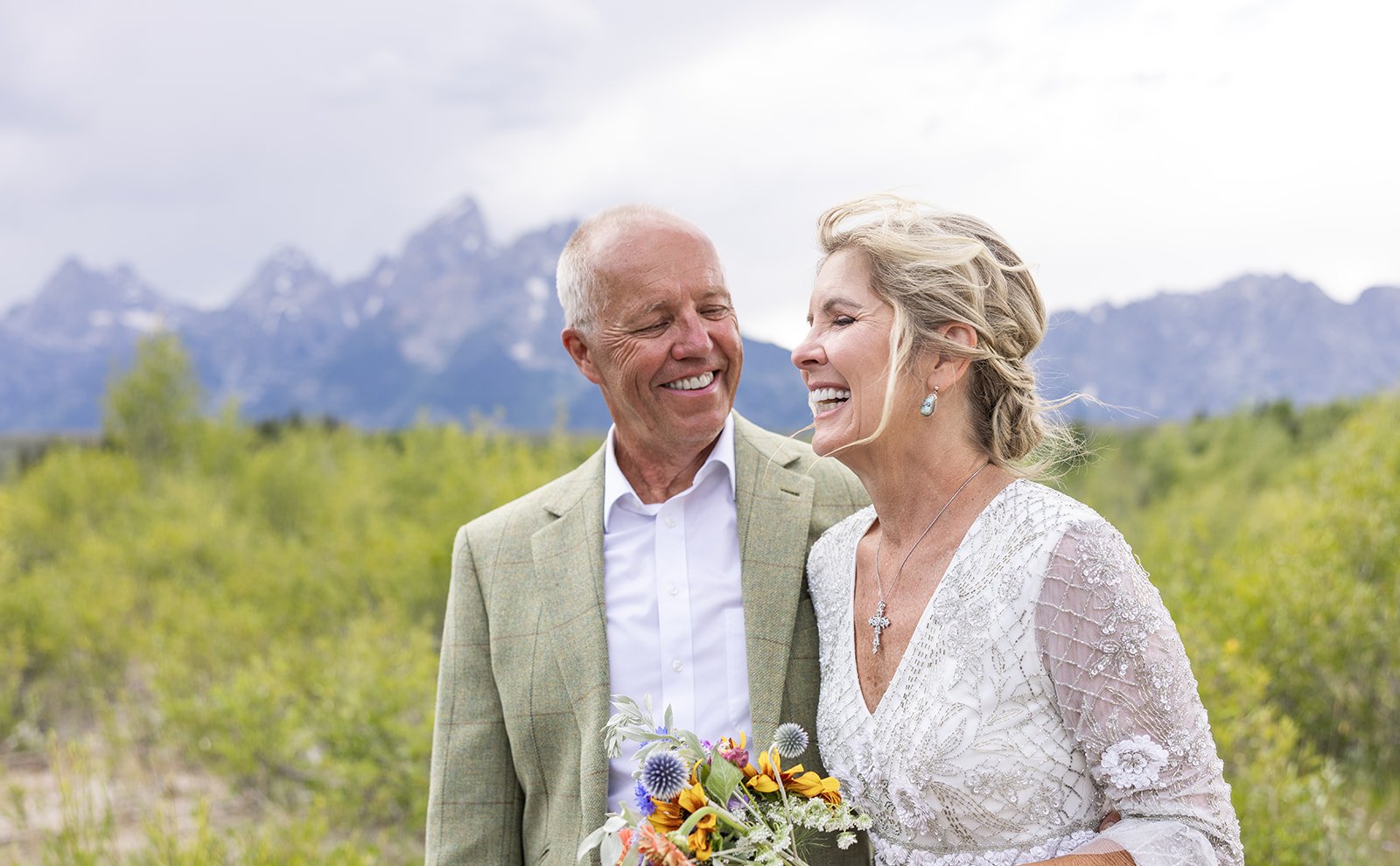 Elopement couple smiling after saying their vows in the Grand Tetons