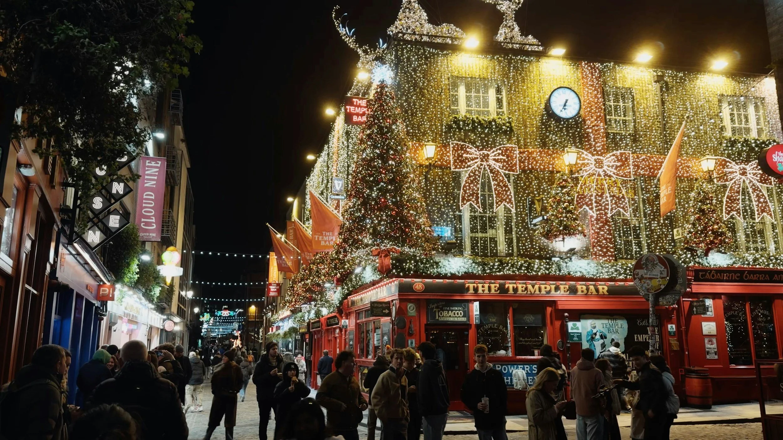 an image of a London street decorated with fairy lights for Christmas