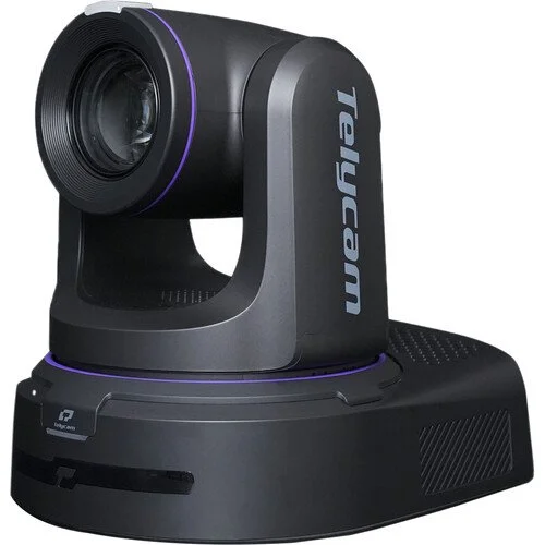 A black robotic camera with the brand name "Telemich" on the side, mounted on a black base with a slot for a card or similar device.