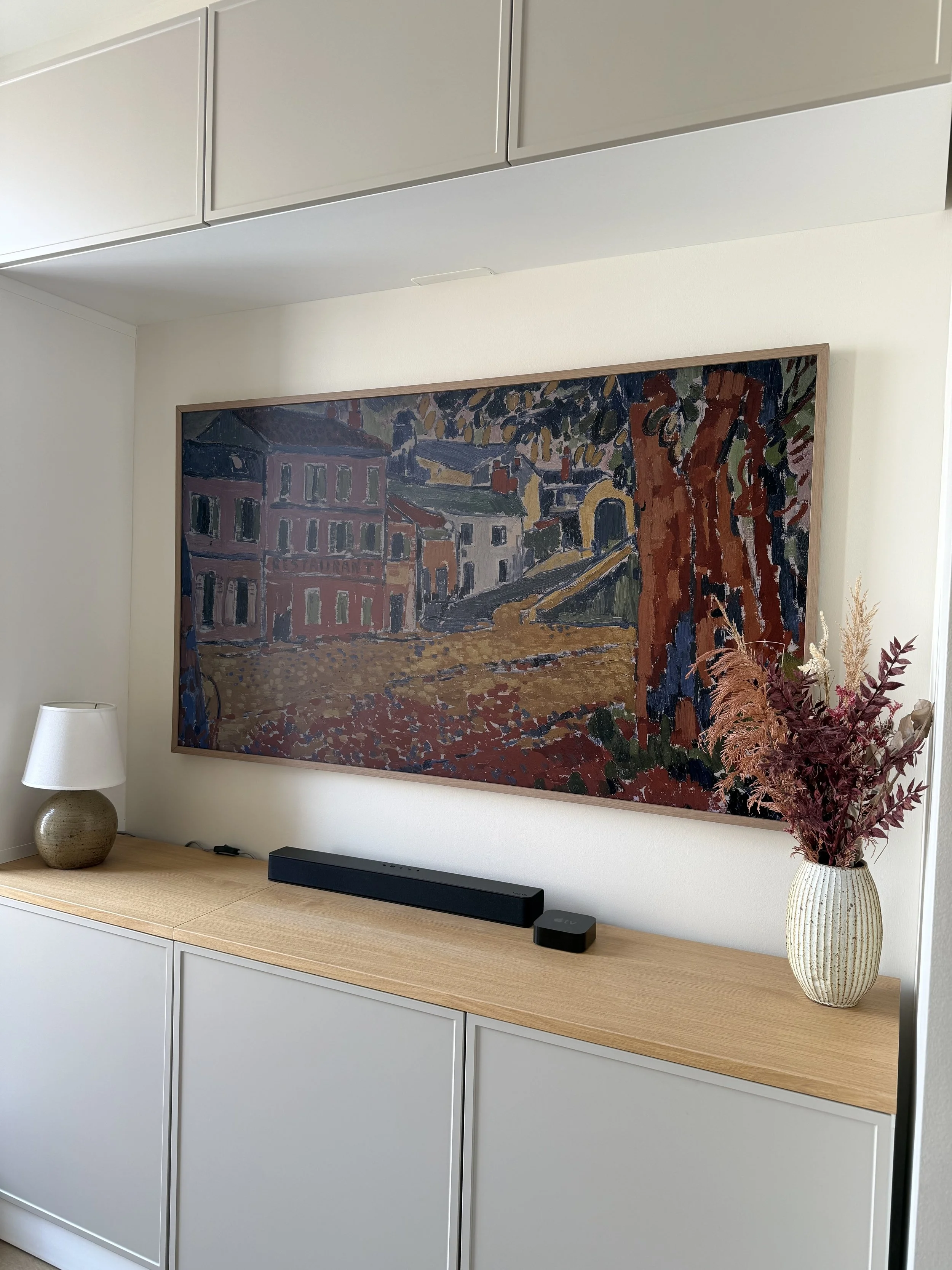 Laurie’s customers, Mariana and Carmen holding hands on a green lawn on their wedding day.