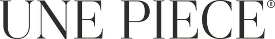 Close-up of the logo 'UNE PIECE' in black text on a white background.