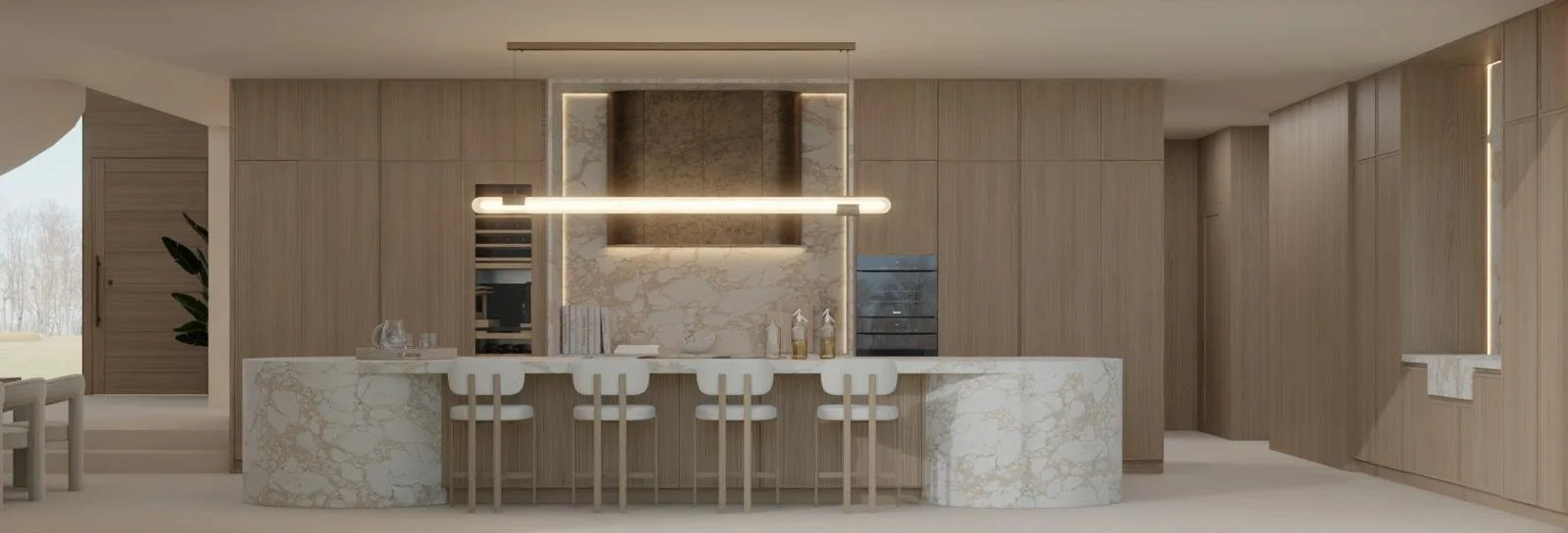 Modern kitchen with a marble island, wooden cabinets, barstools, and a lit ceiling fixture