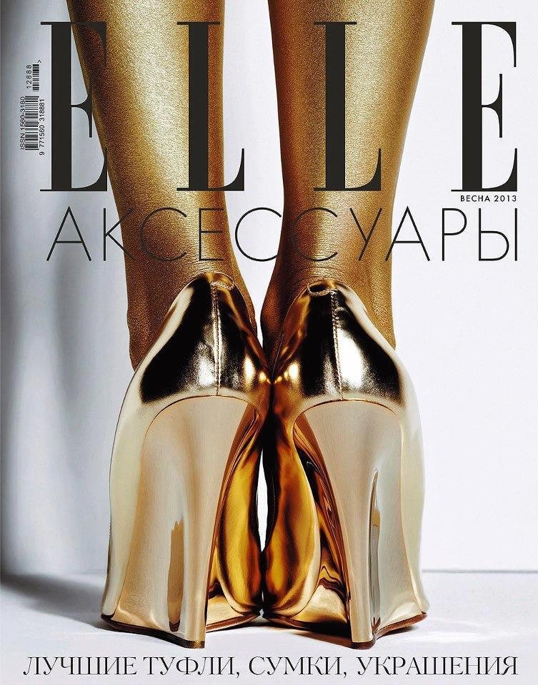 Vogue magazine cover featuring metallic gold high heel shoes and sheer legs with Russian text.