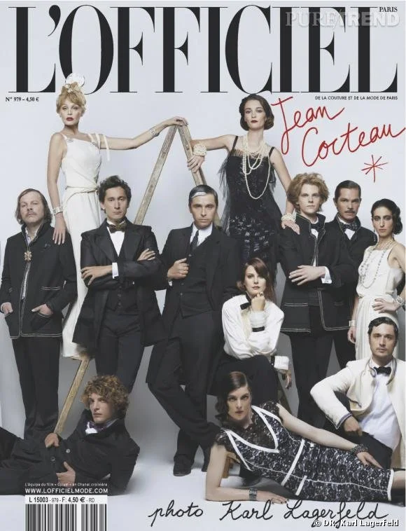 Cover of L'Officiel magazine featuring several well-dressed men and women in vintage formal attire, with some posing standing and others seated or reclining. The background is white, with handwritten text 'Team Cocteau' and a star drawn in red ink.