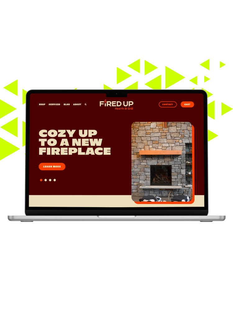 A laptop displaying a website for 'Fired Up Hearth & Grill' with a fireplace picture, a headline 'Cozy Up to a New Fireplace', and navigation options including shop, services, blog, about, contact, and cart, against a bright green background with abstract shapes.