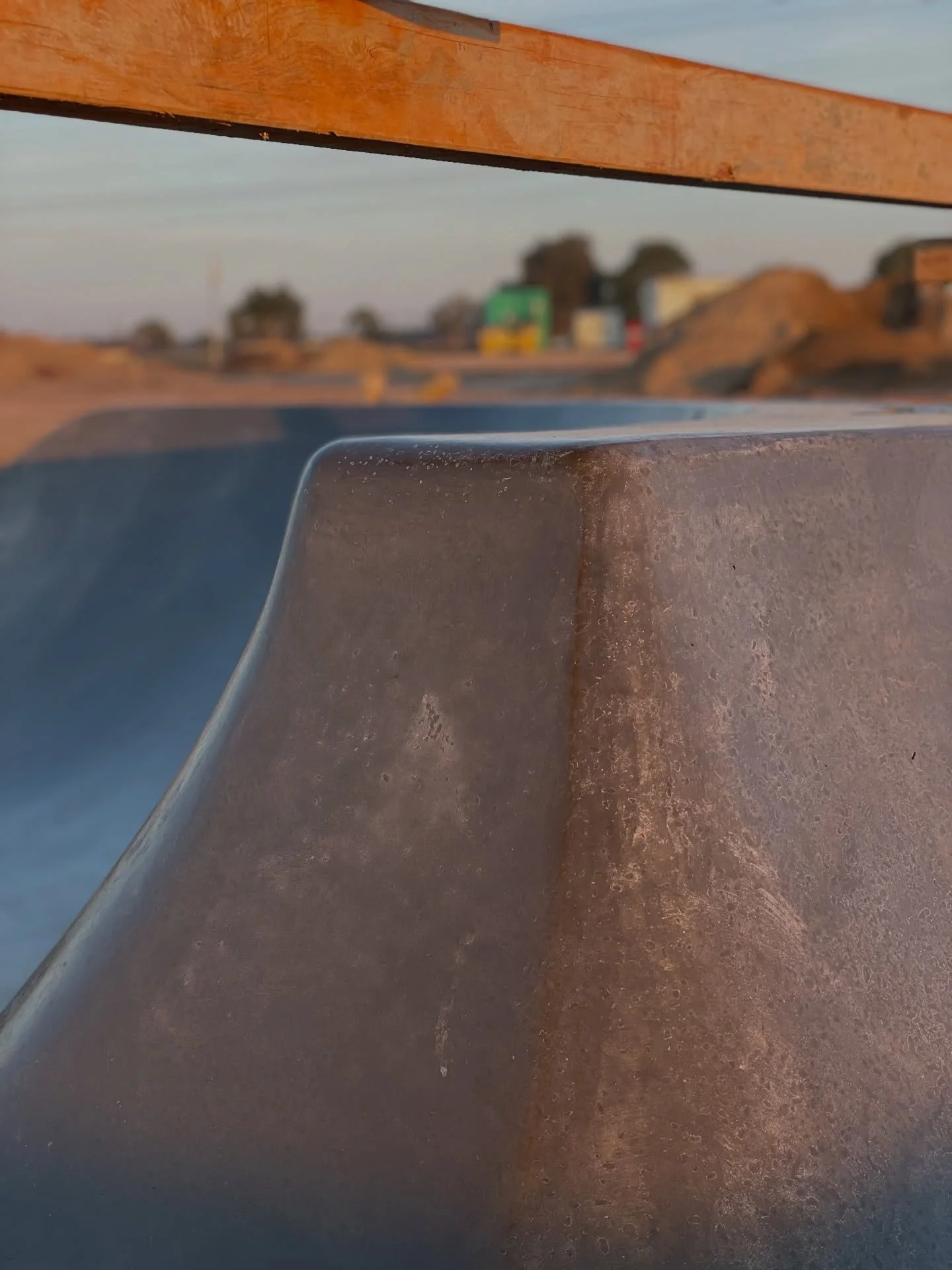 Shotcrete is sprayed into place instead of poured, which allows it to follow complex shapes and vertical surfaces. After placement, we hand-trowel the material as it sets, working the surface into a dense, burnished finish that closes the pores and l