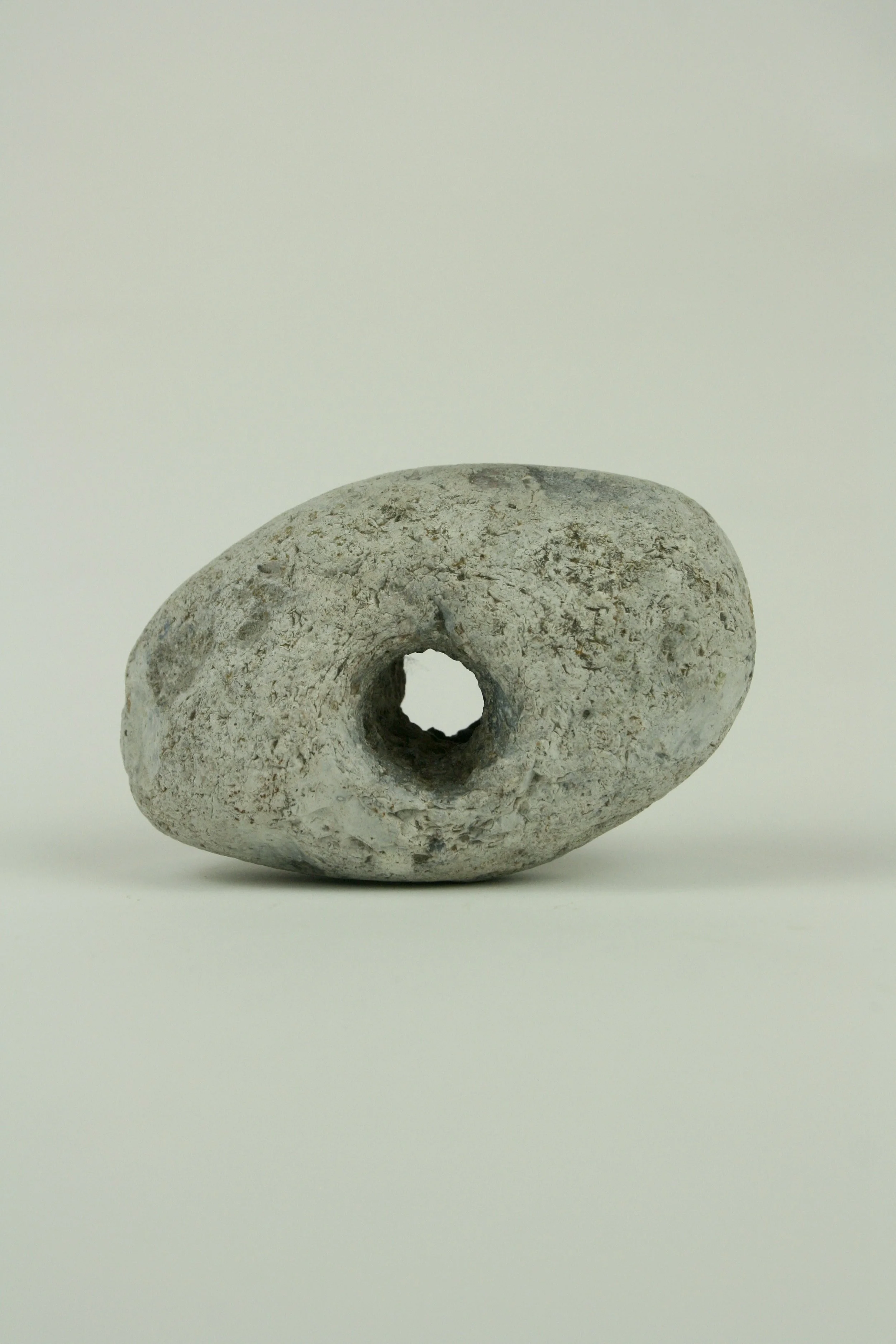 Holed stone